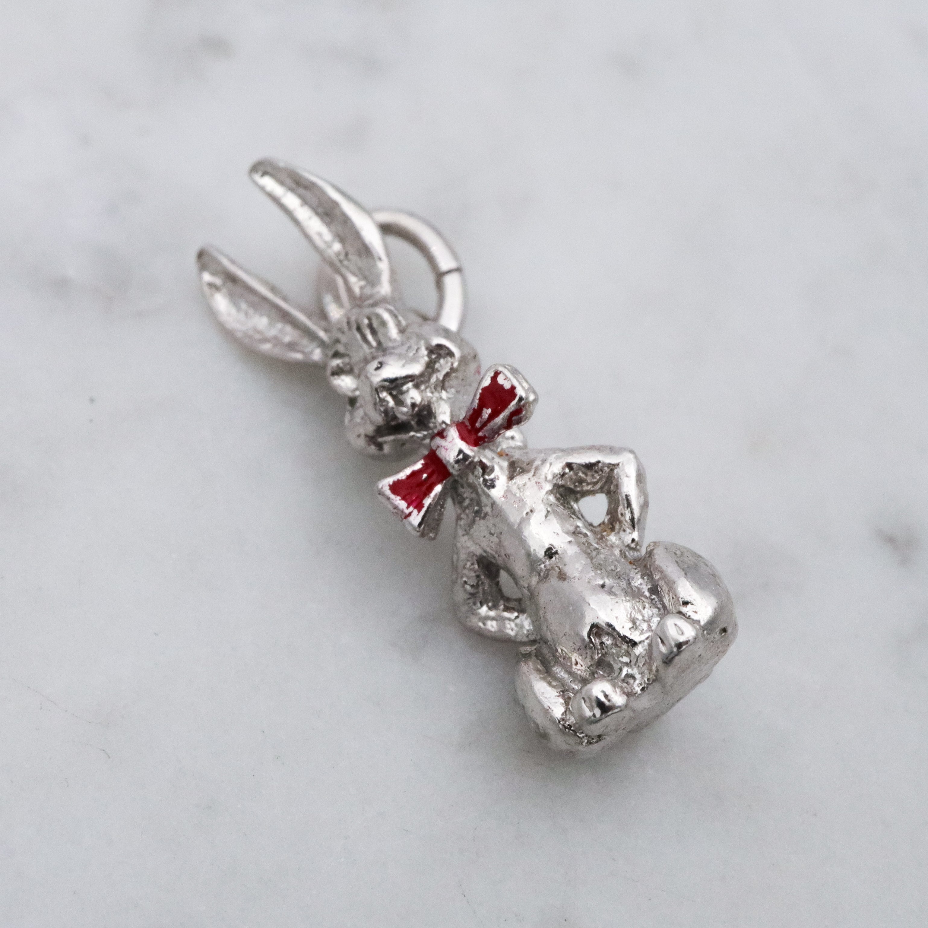 Vintage sterling seated bunny with red bowtie & nodding head