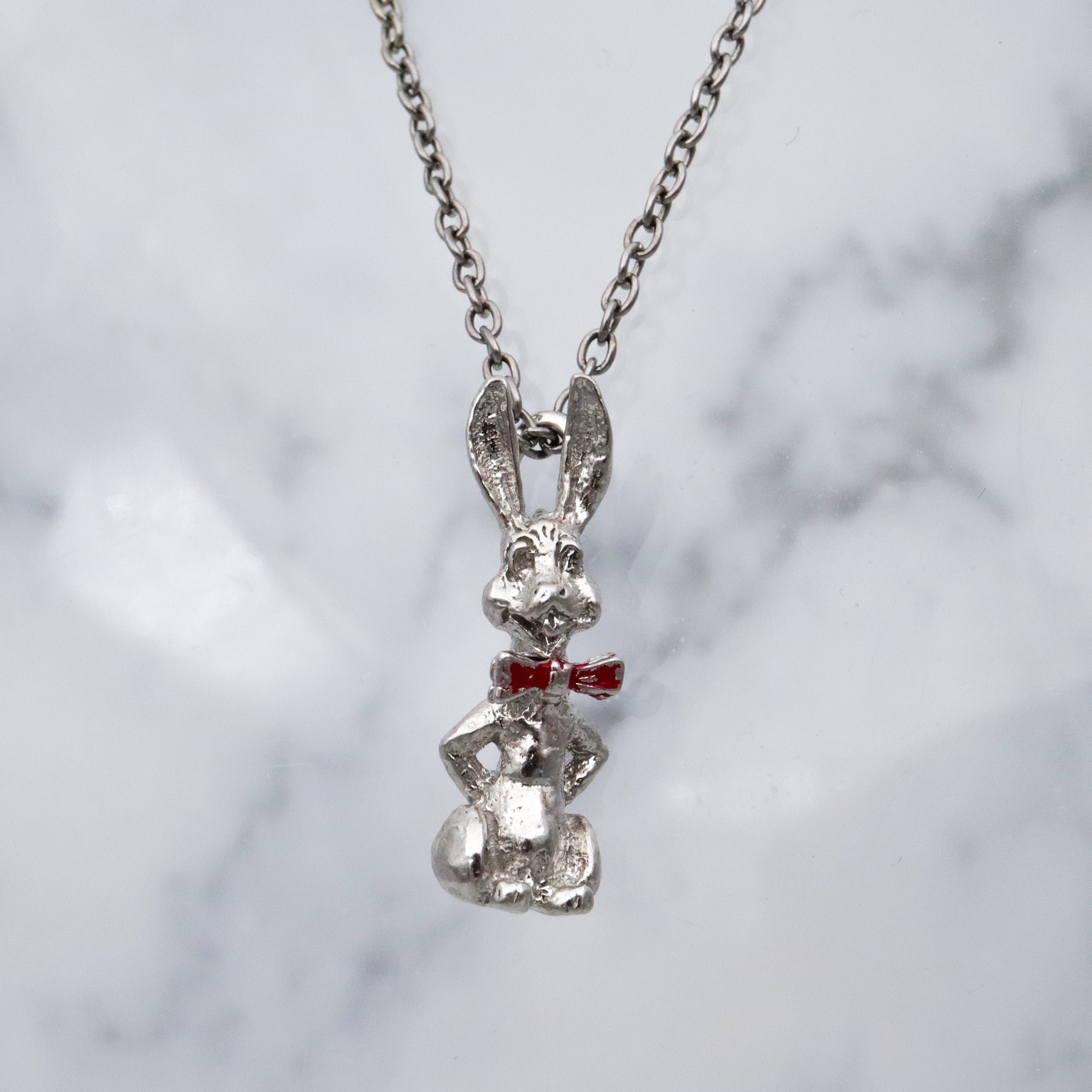 Vintage sterling seated bunny with red bowtie & nodding head