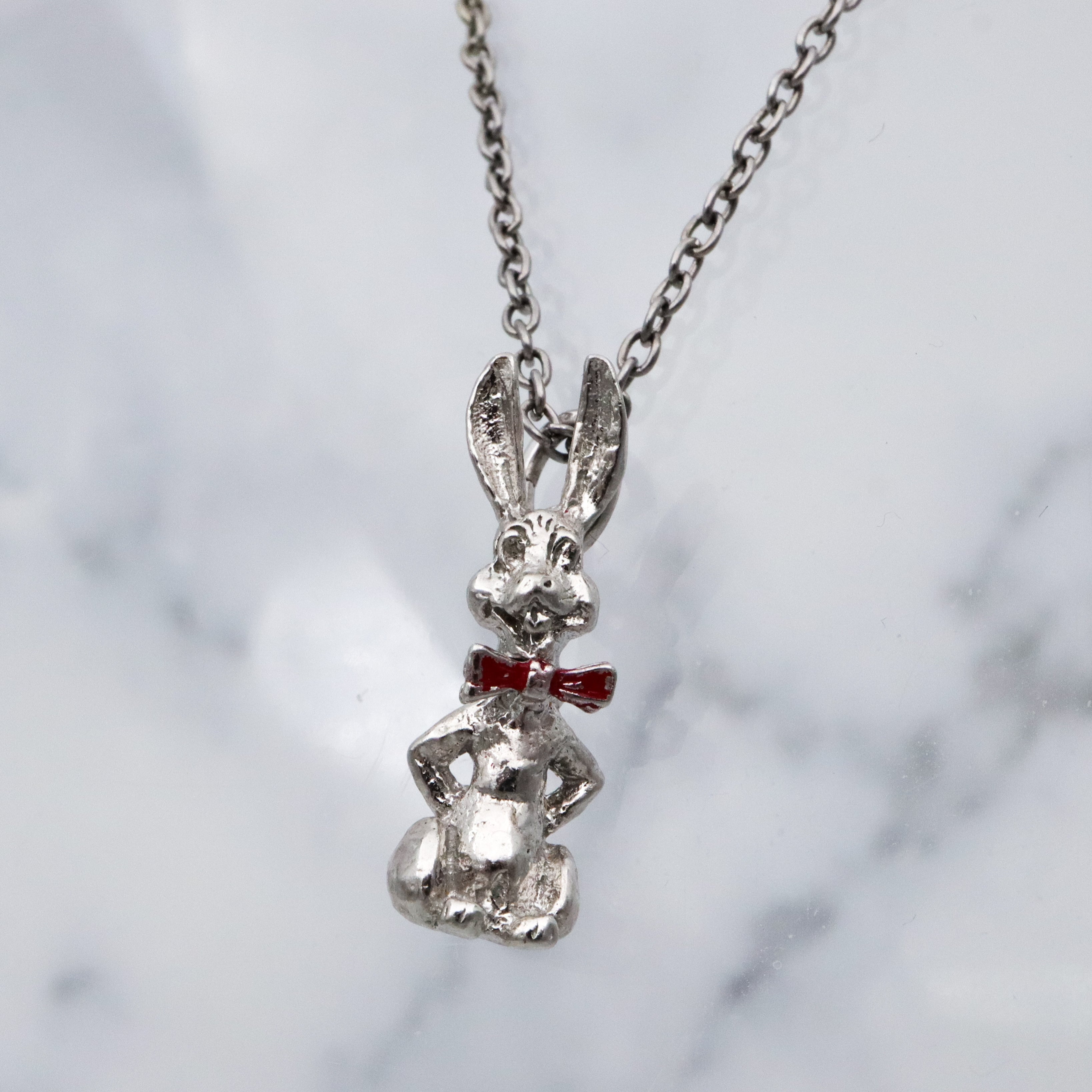 Vintage sterling seated bunny with red bowtie & nodding head