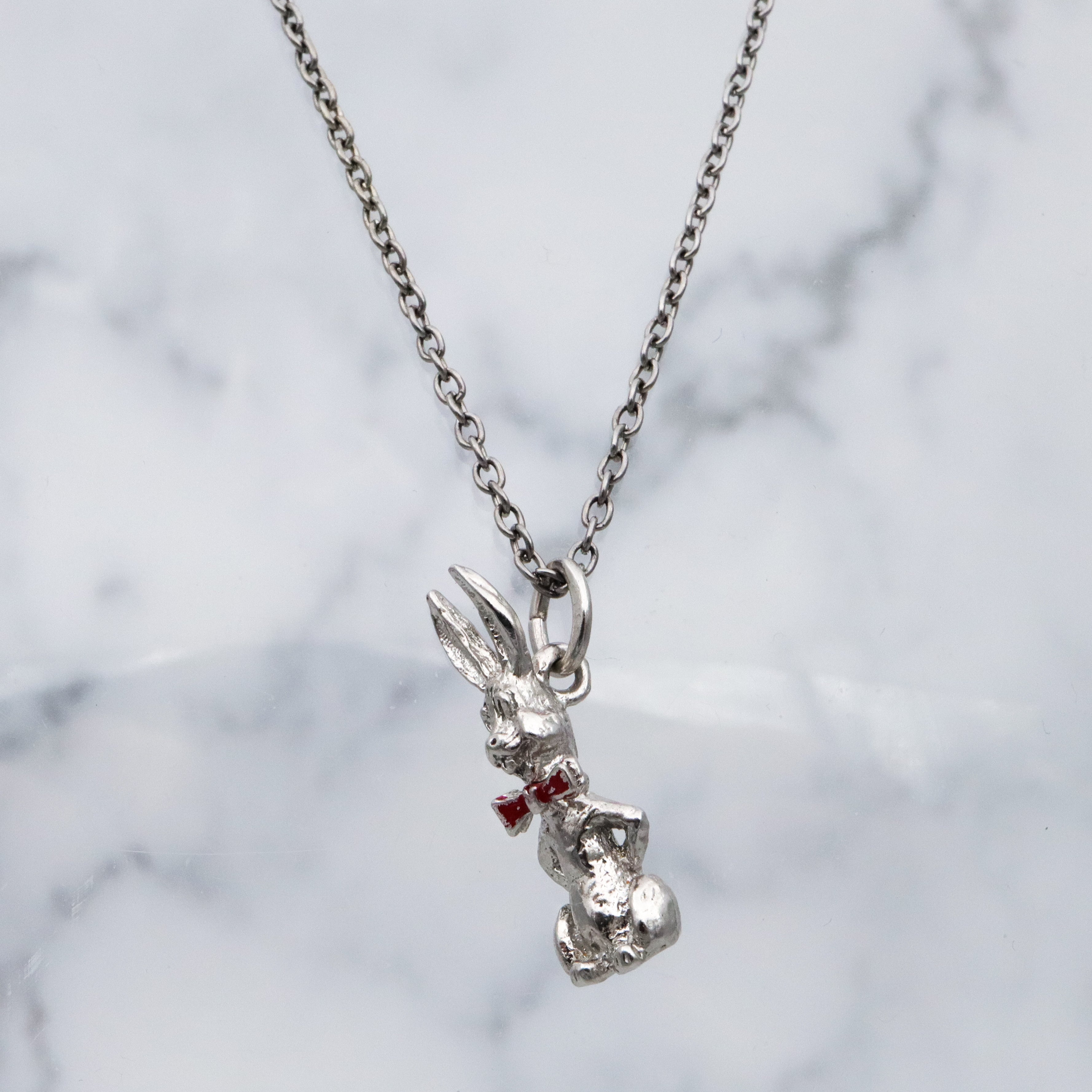 Vintage sterling seated bunny with red bowtie & nodding head