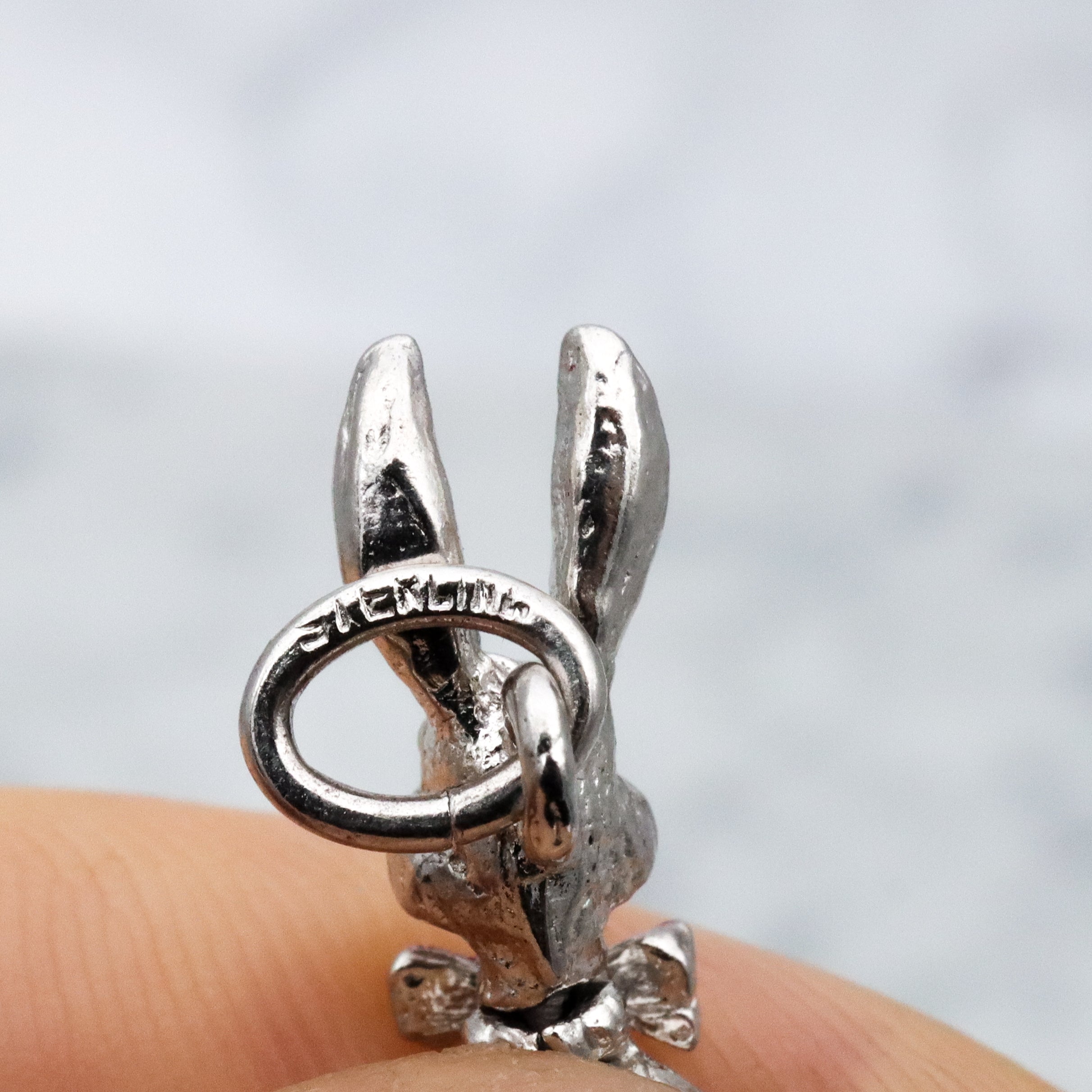 Vintage sterling seated bunny with red bowtie & nodding head