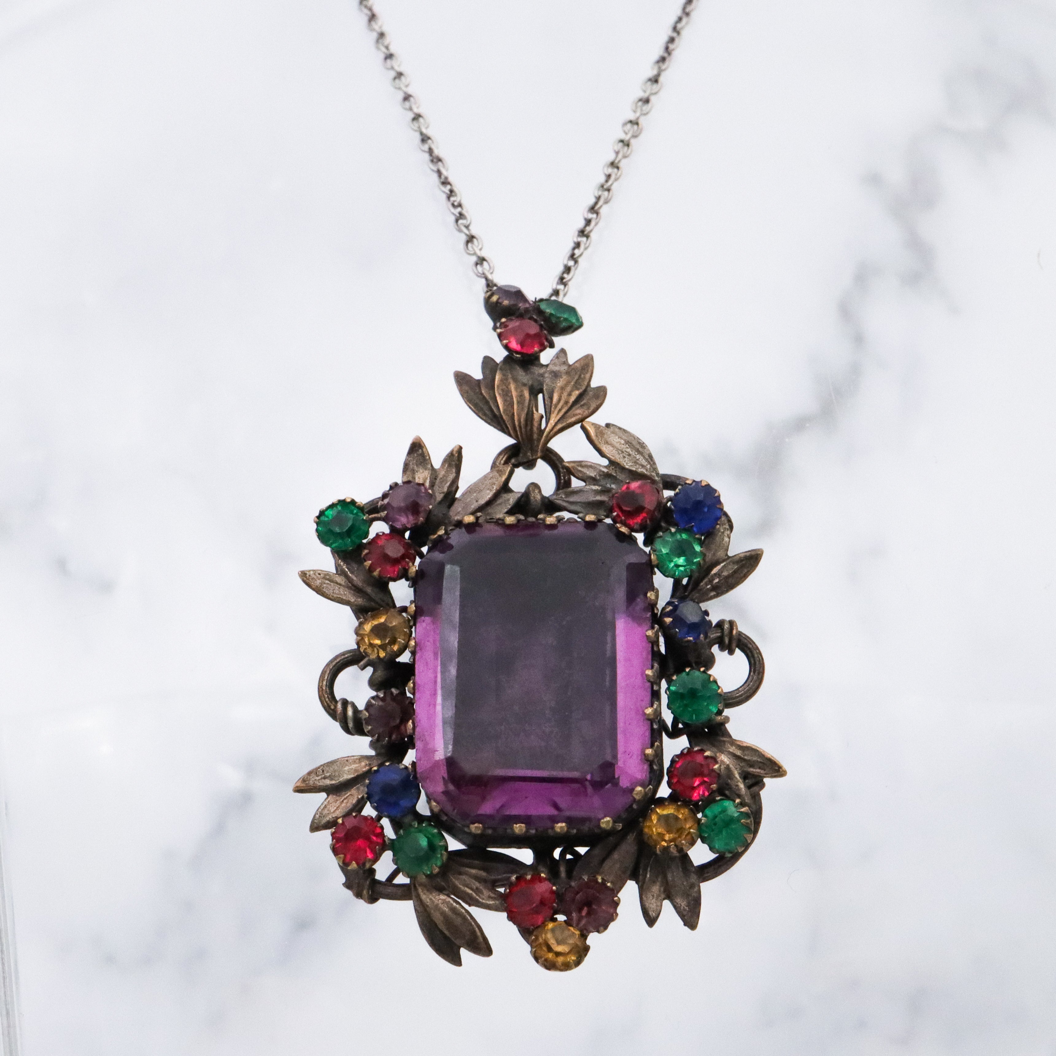Antique harlequin Czech crystal faux amethyst floral locket pendant