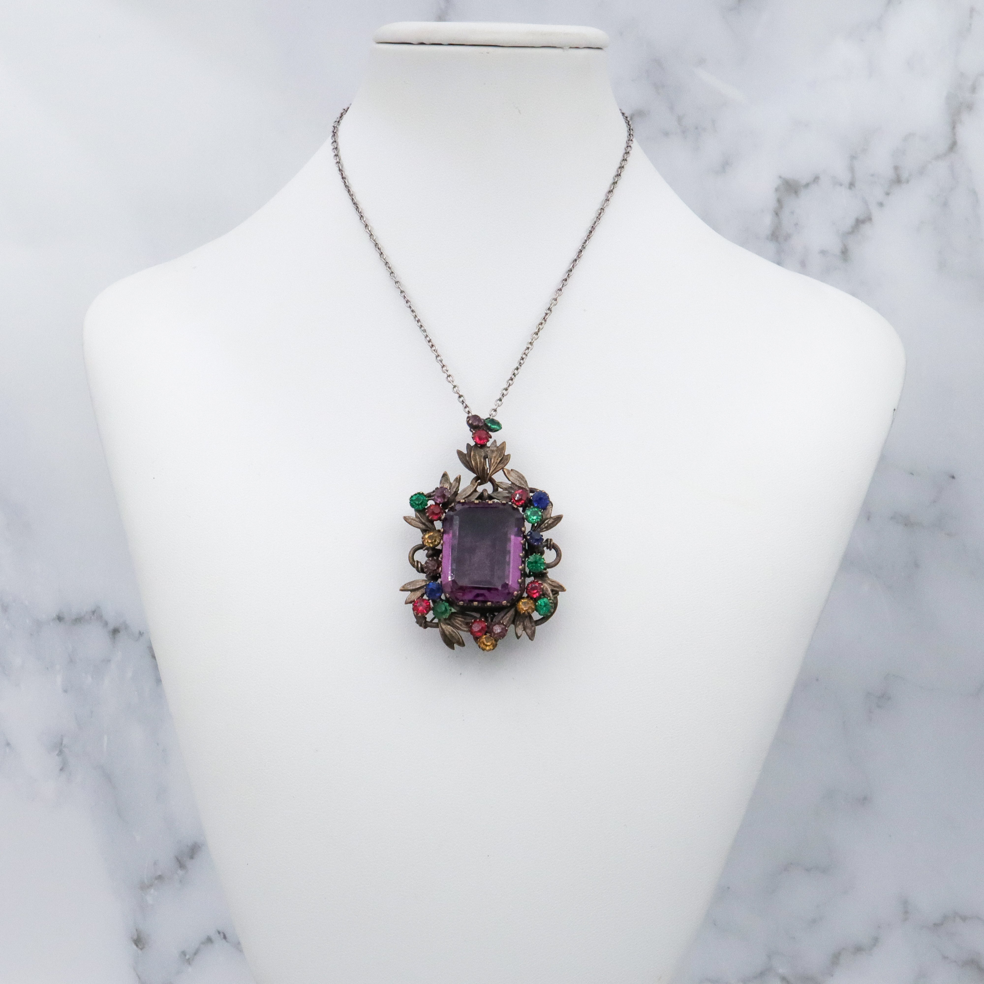 Antique harlequin Czech crystal faux amethyst floral locket pendant