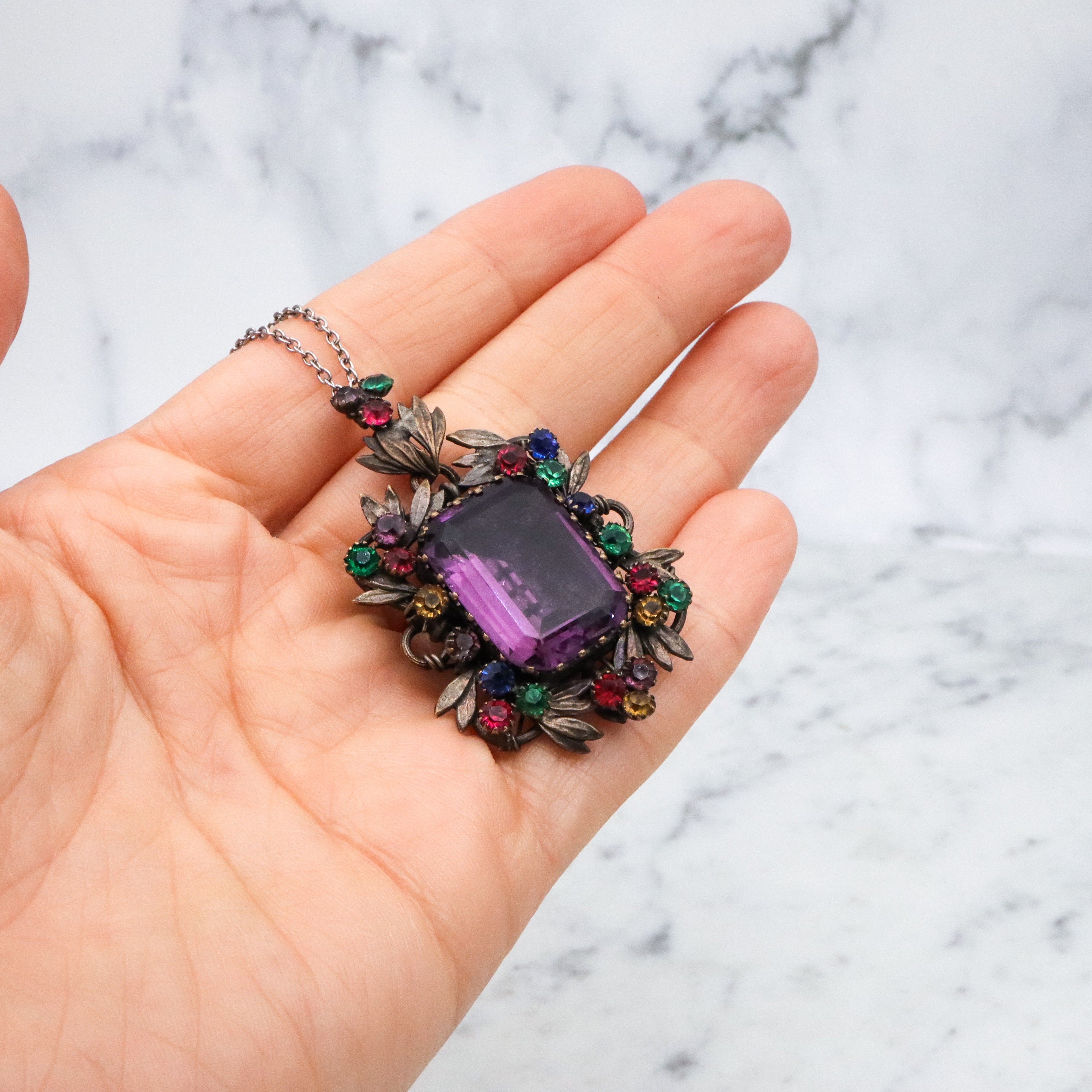 Antique harlequin Czech crystal faux amethyst floral locket pendant