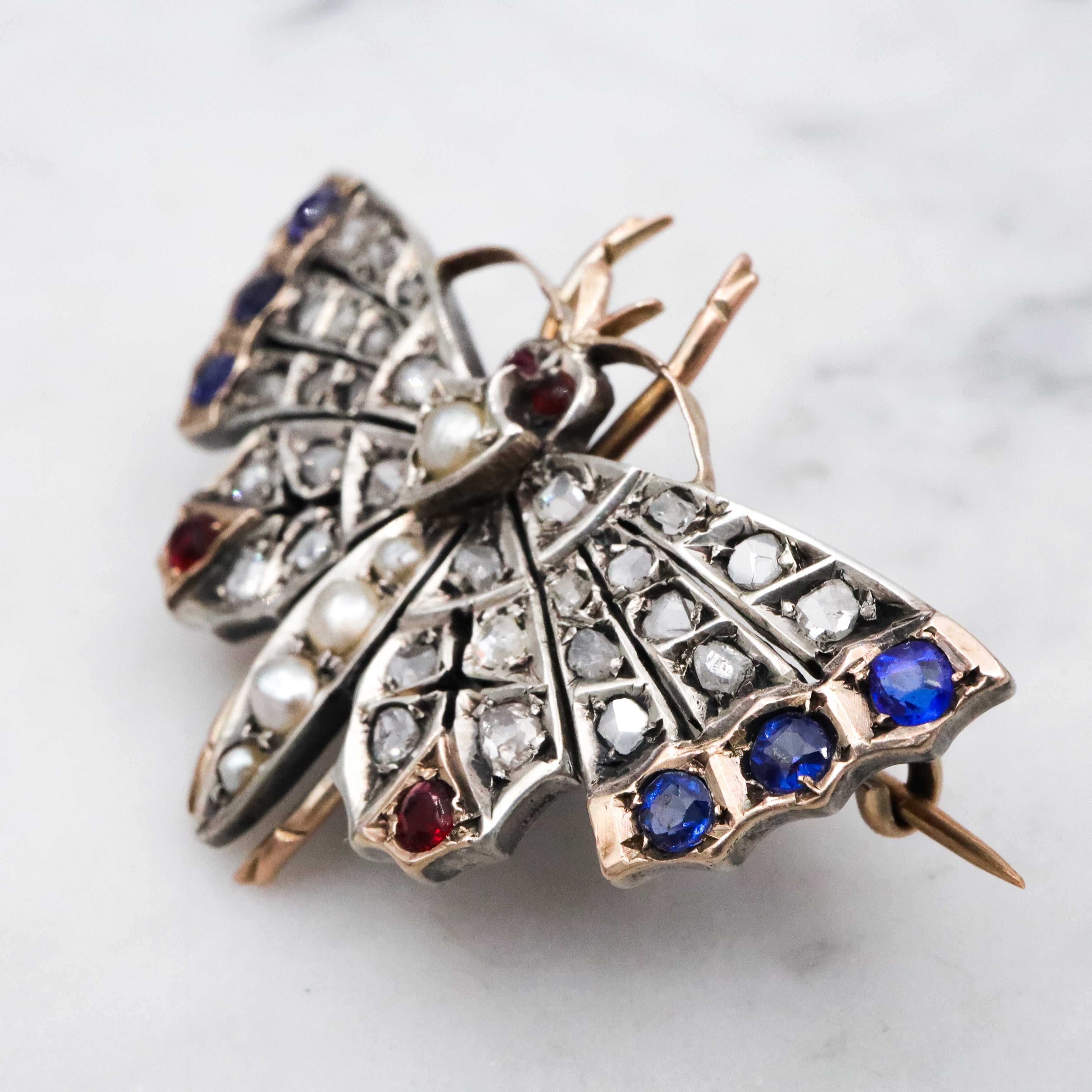 Antique Victorian rose cut diamond, ruby, & sapphire butterfly brooch