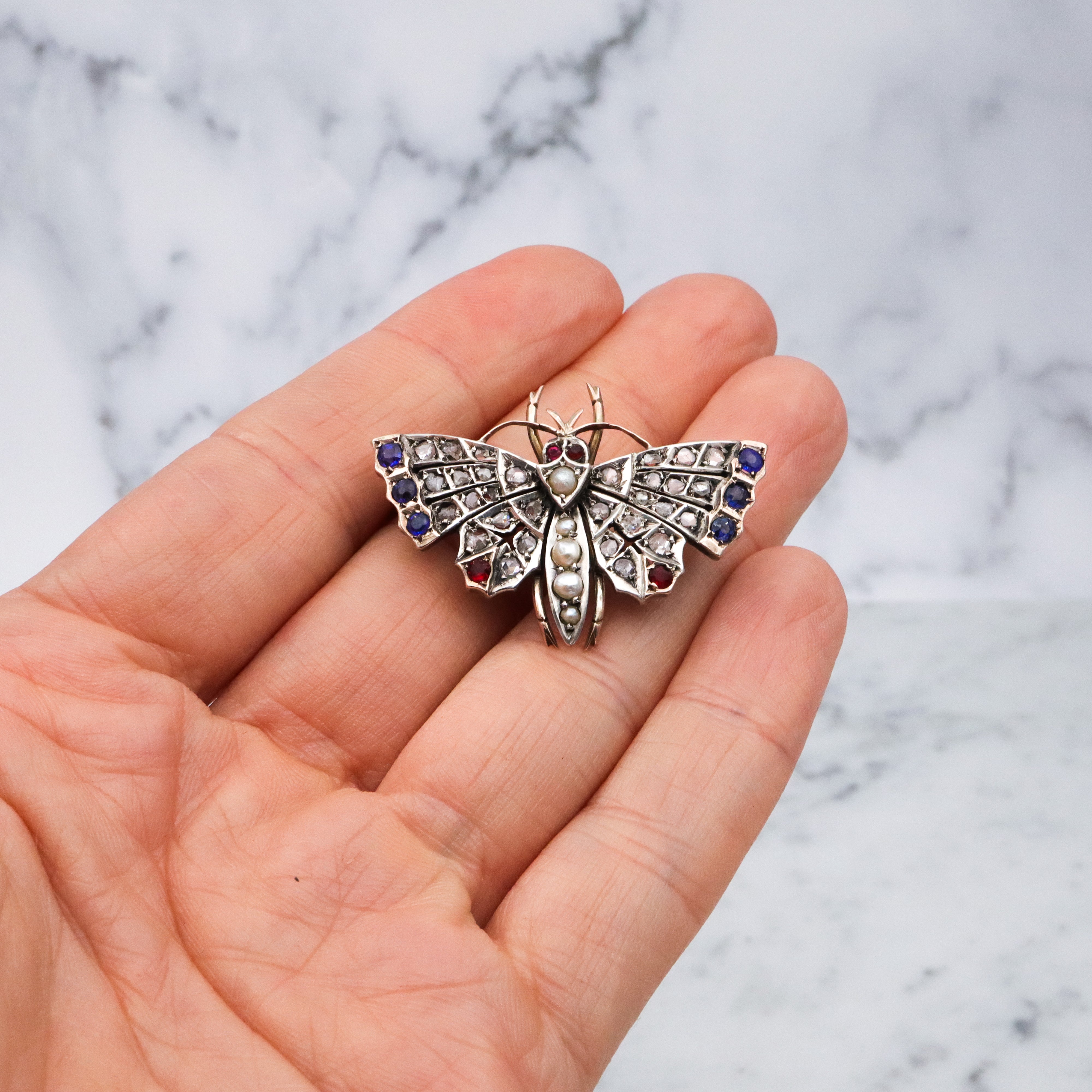 Antique Victorian rose cut diamond, ruby, & sapphire butterfly brooch