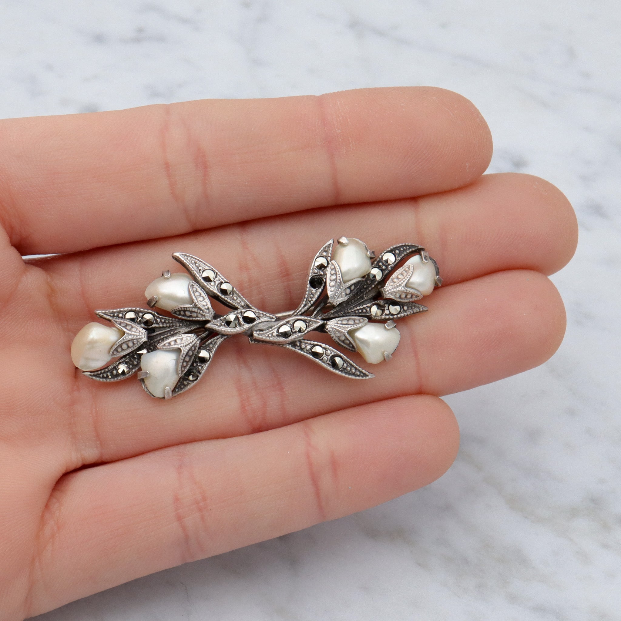 Antique Art Deco sterling, baby tooth pearl & marcasite floral spray brooch