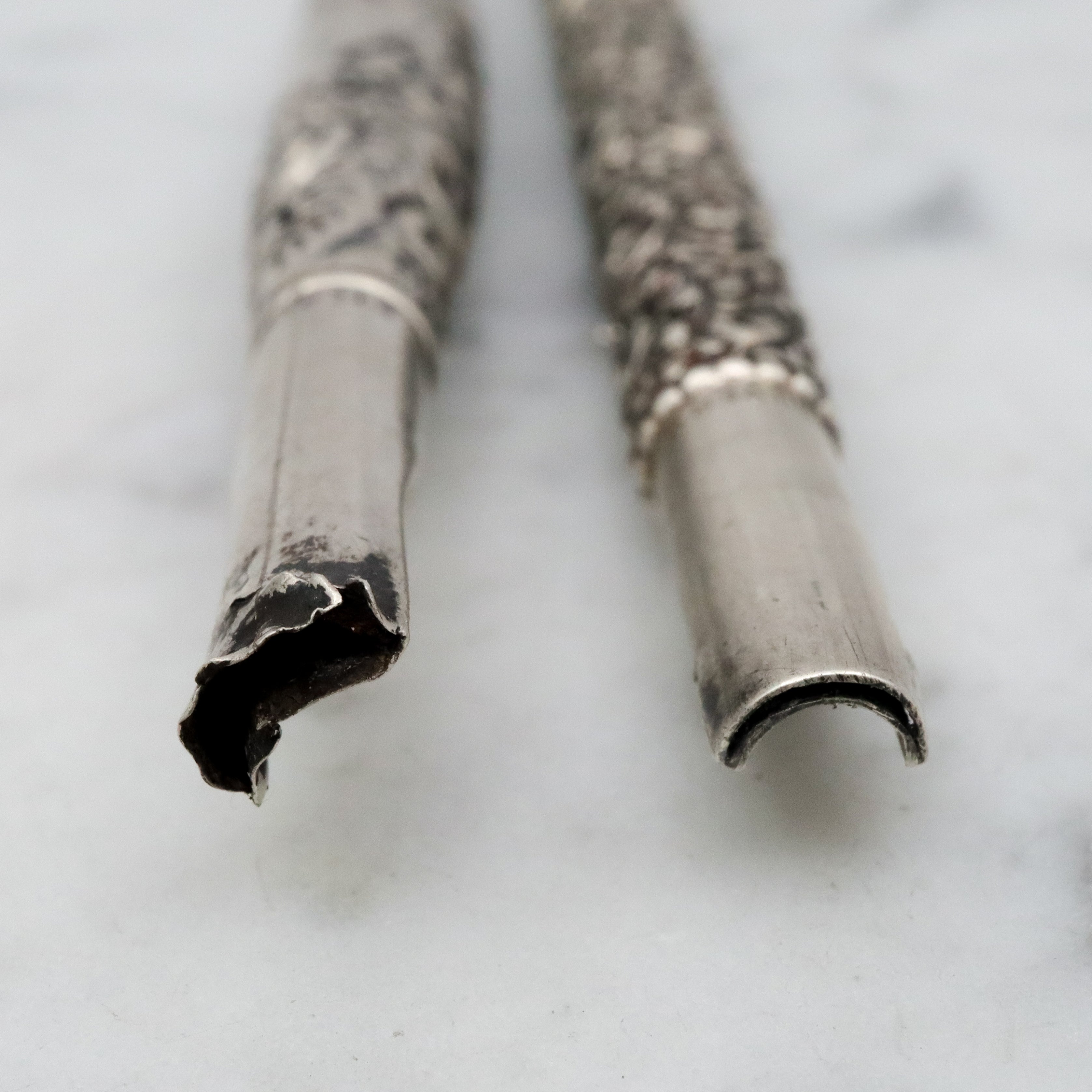 Group of two antique Victorian sterling repousse calligraphy dip pens