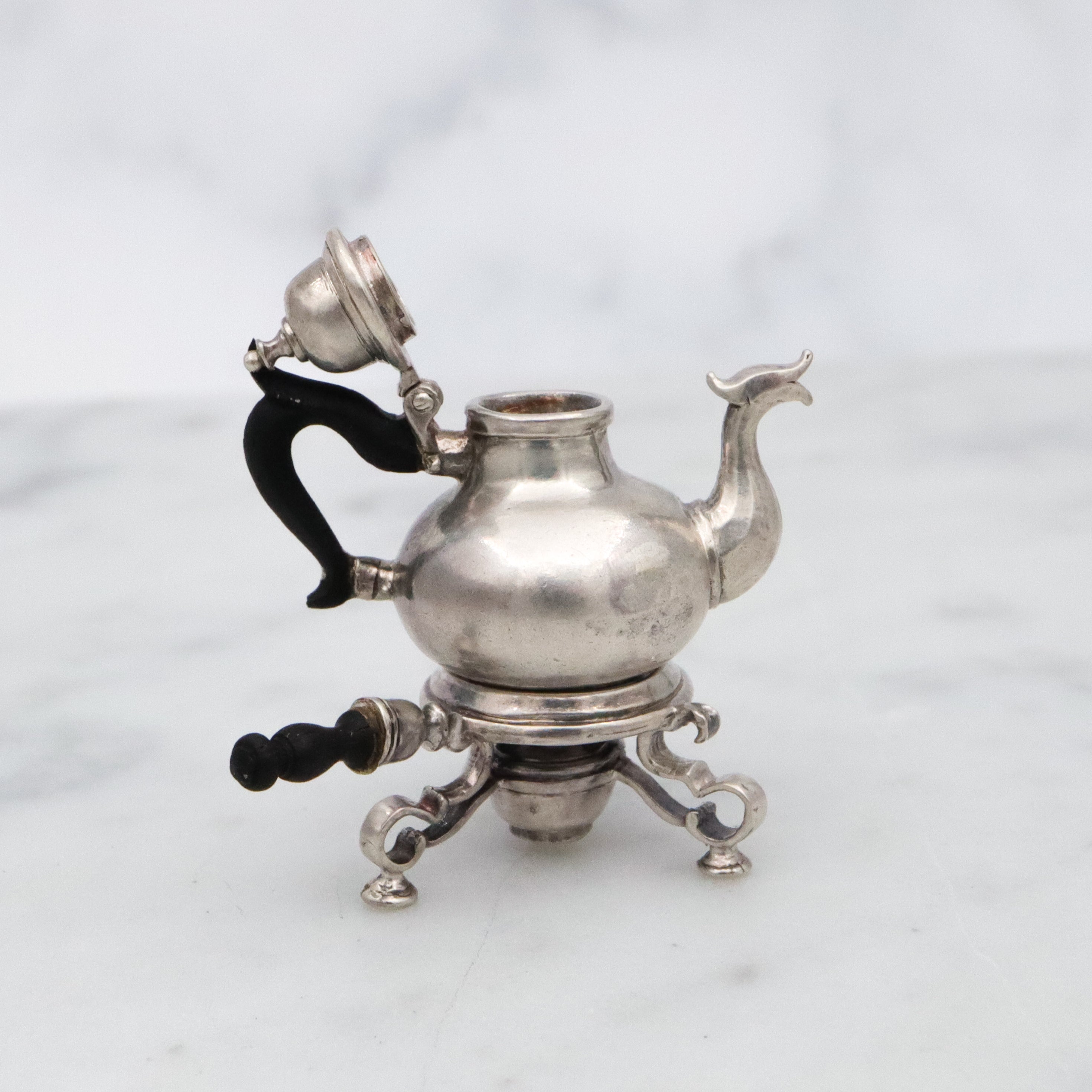Vintage Obadiah Fisher sterling & ebony miniature teapot and warming stand