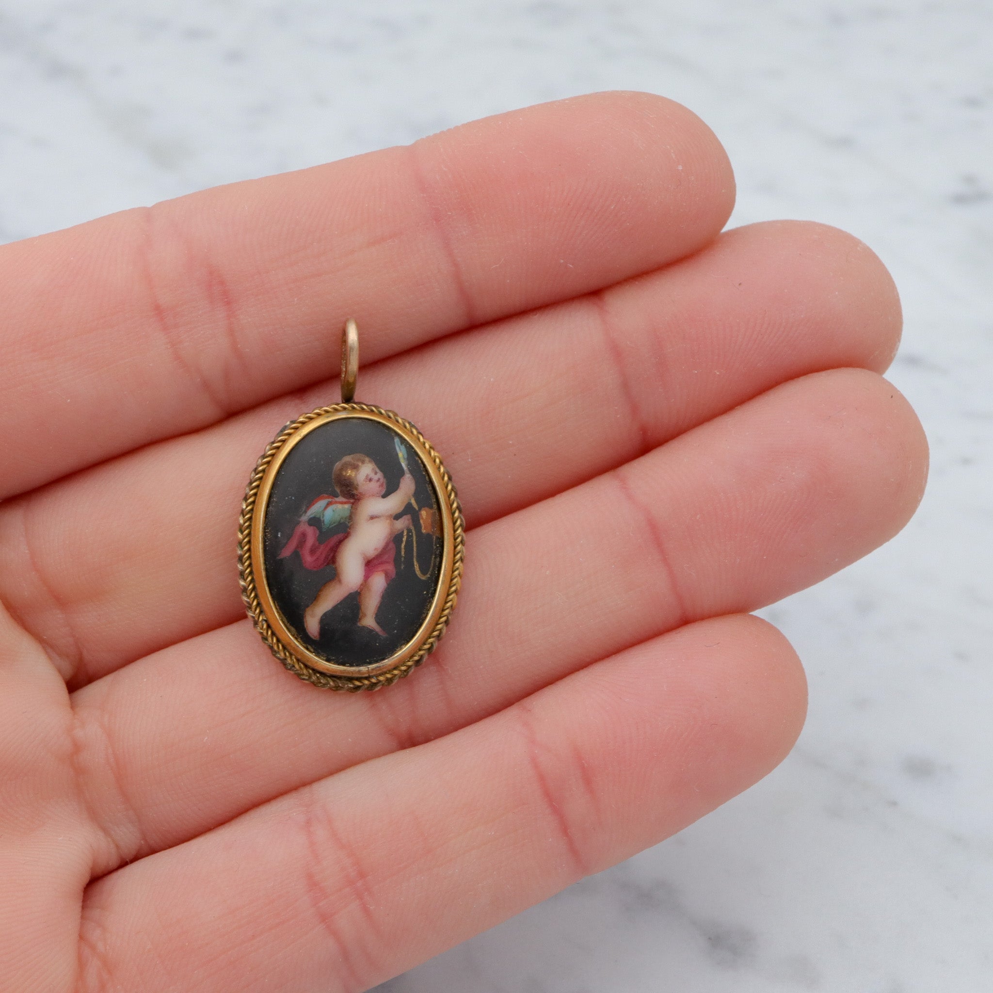 Antique Victorian hand painted winged cherub gilt metal pendant