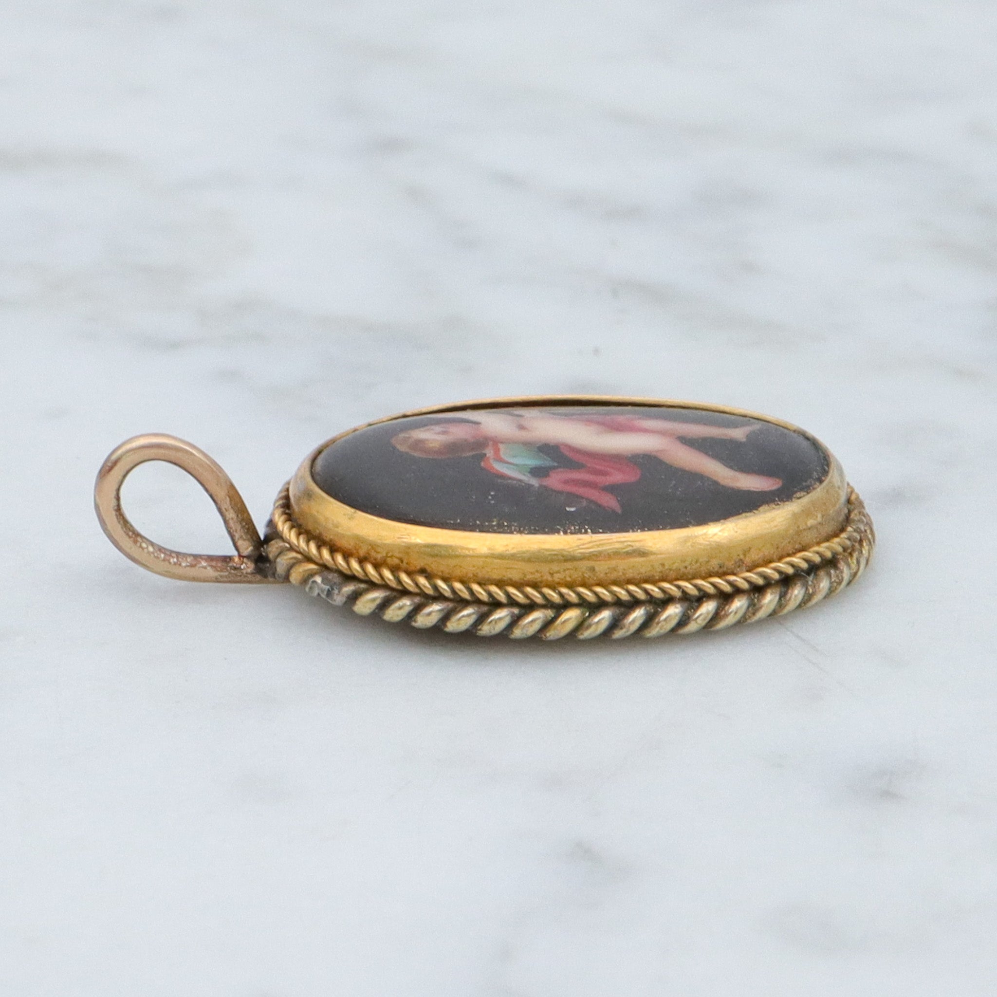 Antique Victorian hand painted winged cherub gilt metal pendant