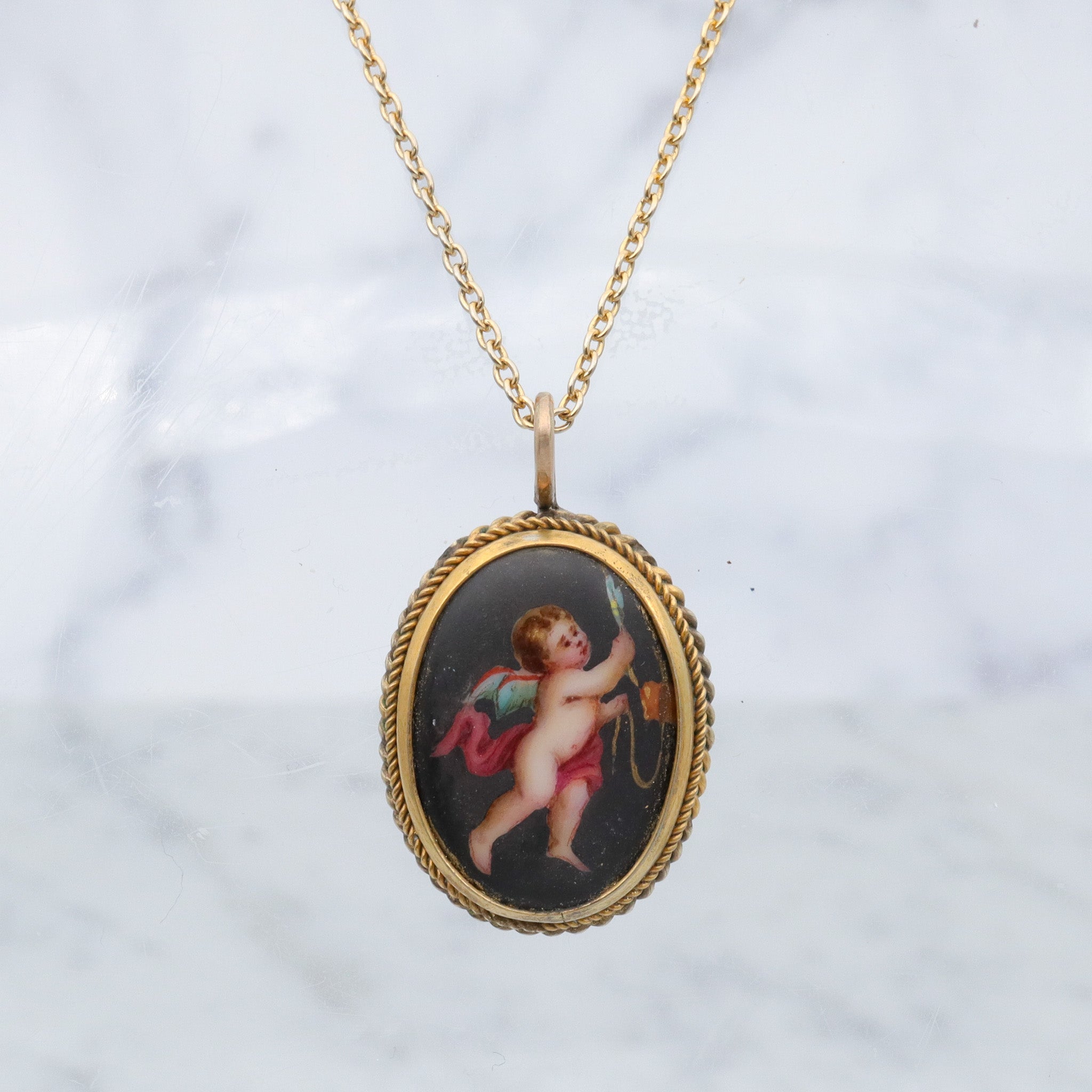 Antique Victorian hand painted winged cherub gilt metal pendant