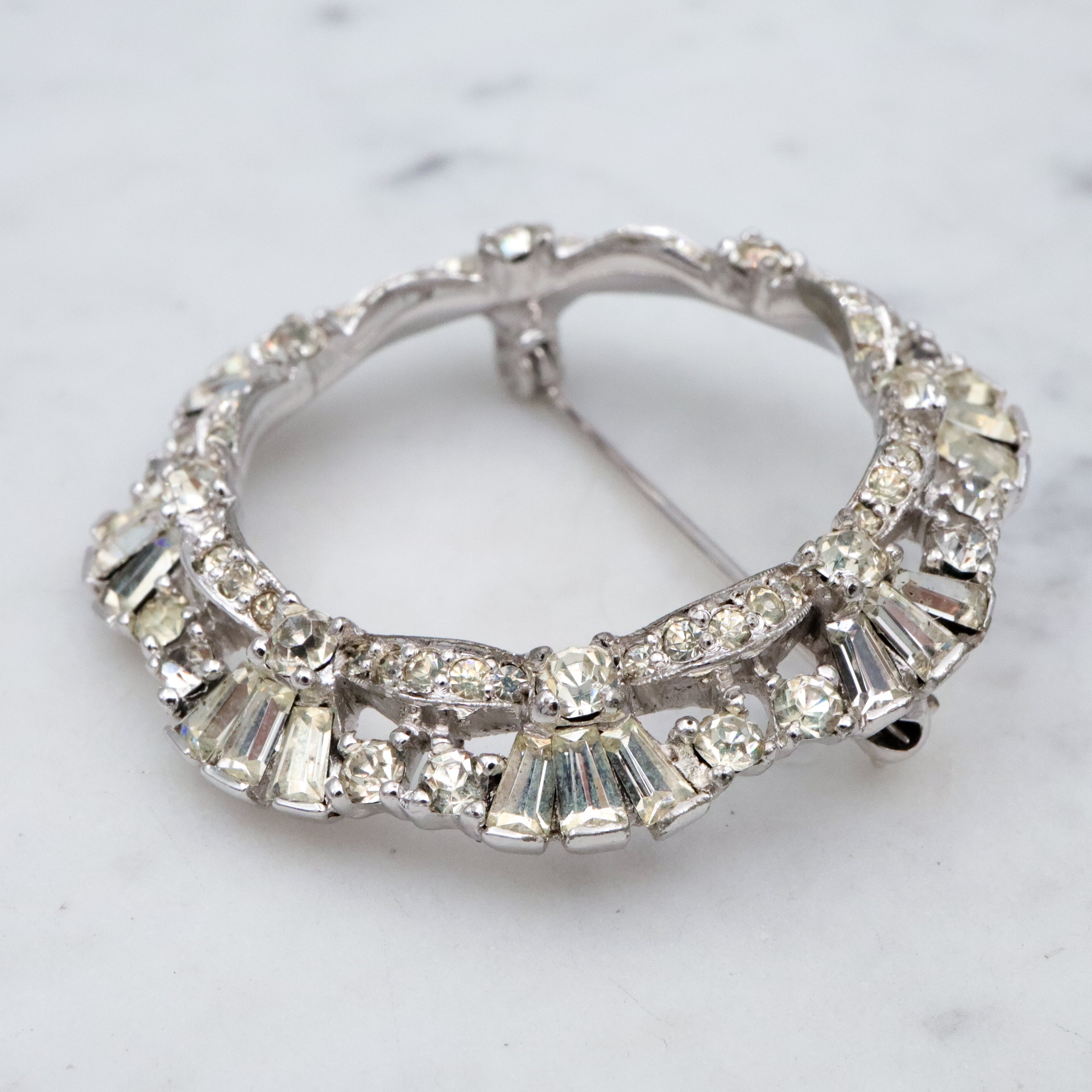 Art Deco Revival Jomaz rhodium plated rhinestone open wreath brooch
