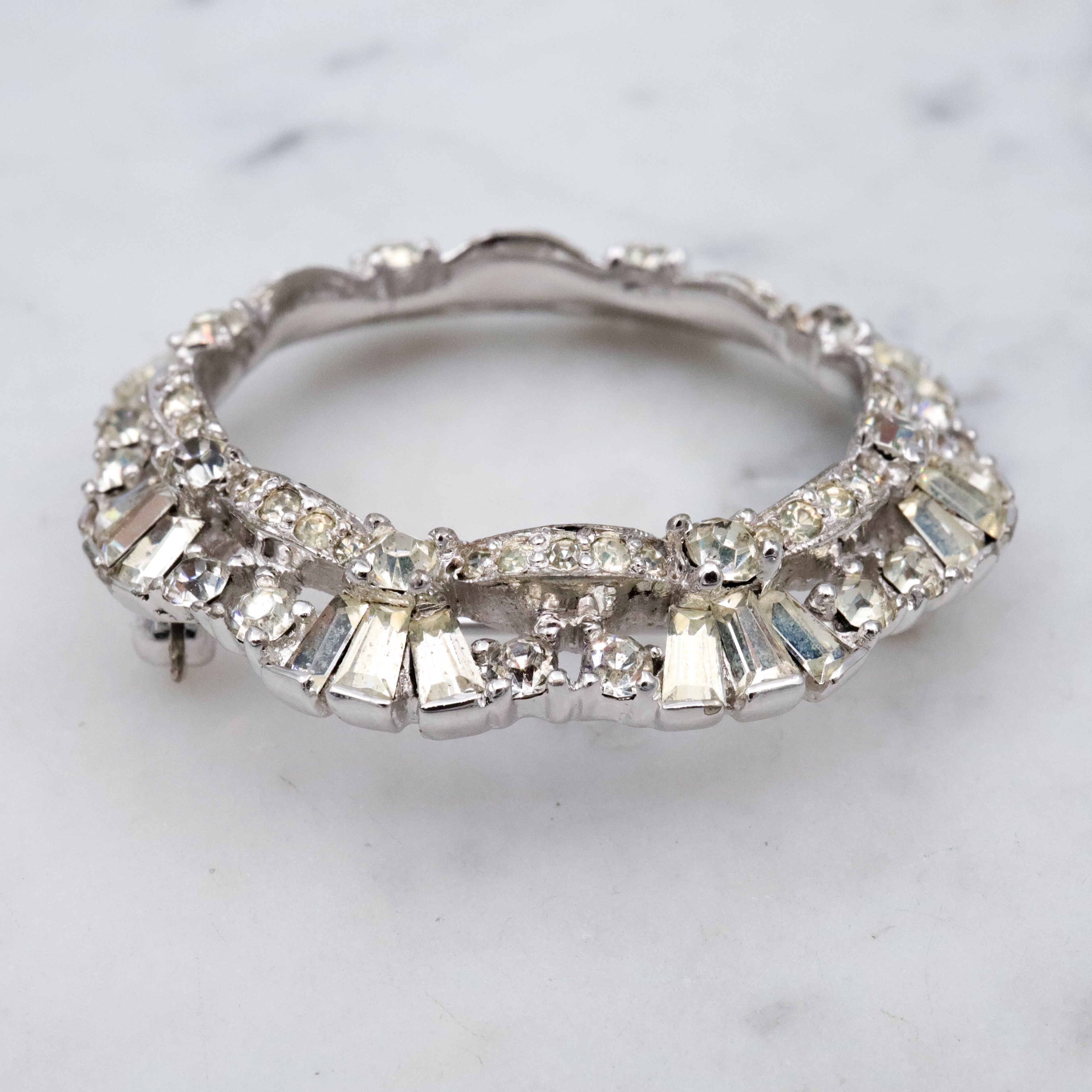 Art Deco Revival Jomaz rhodium plated rhinestone open wreath brooch