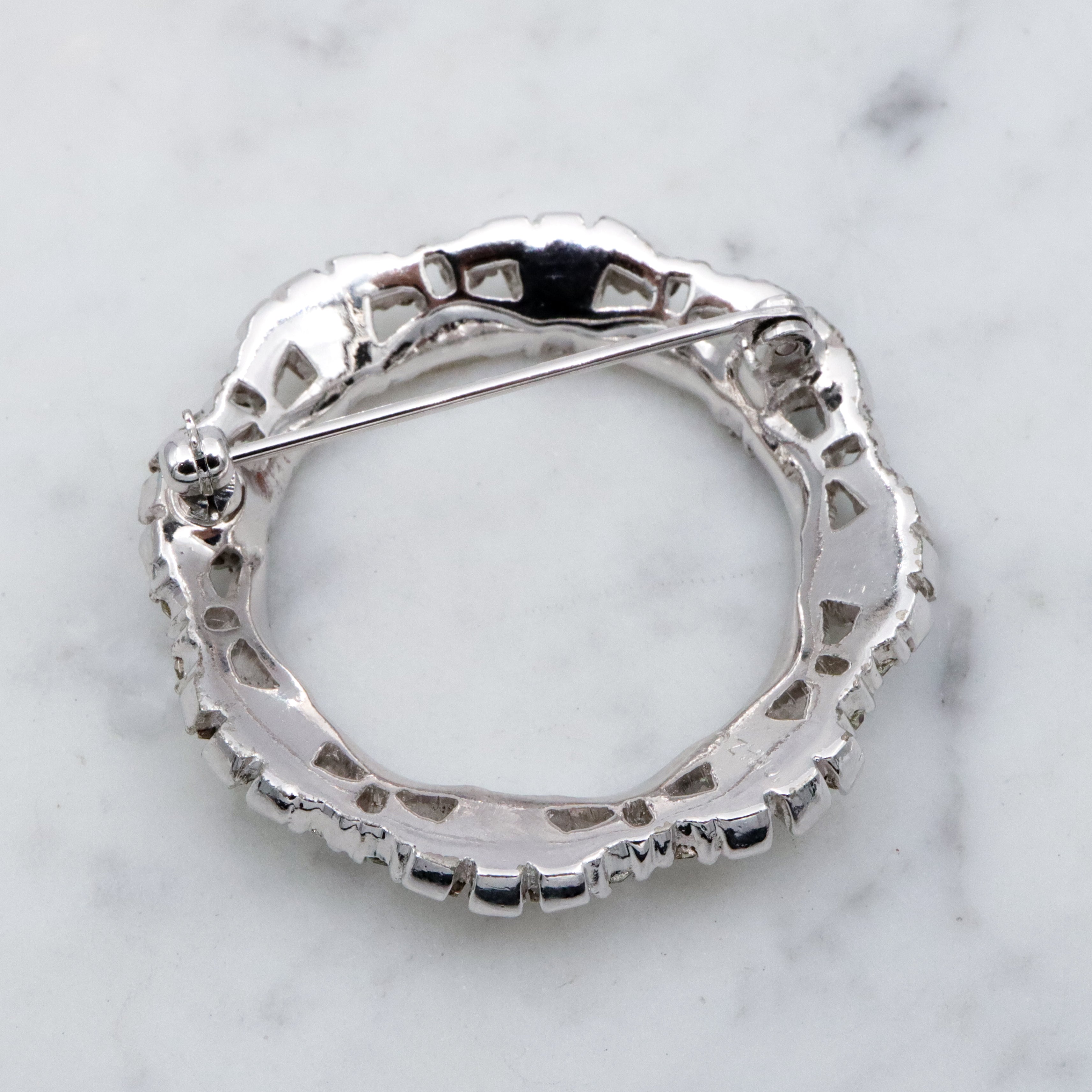 Art Deco Revival Jomaz rhodium plated rhinestone open wreath brooch