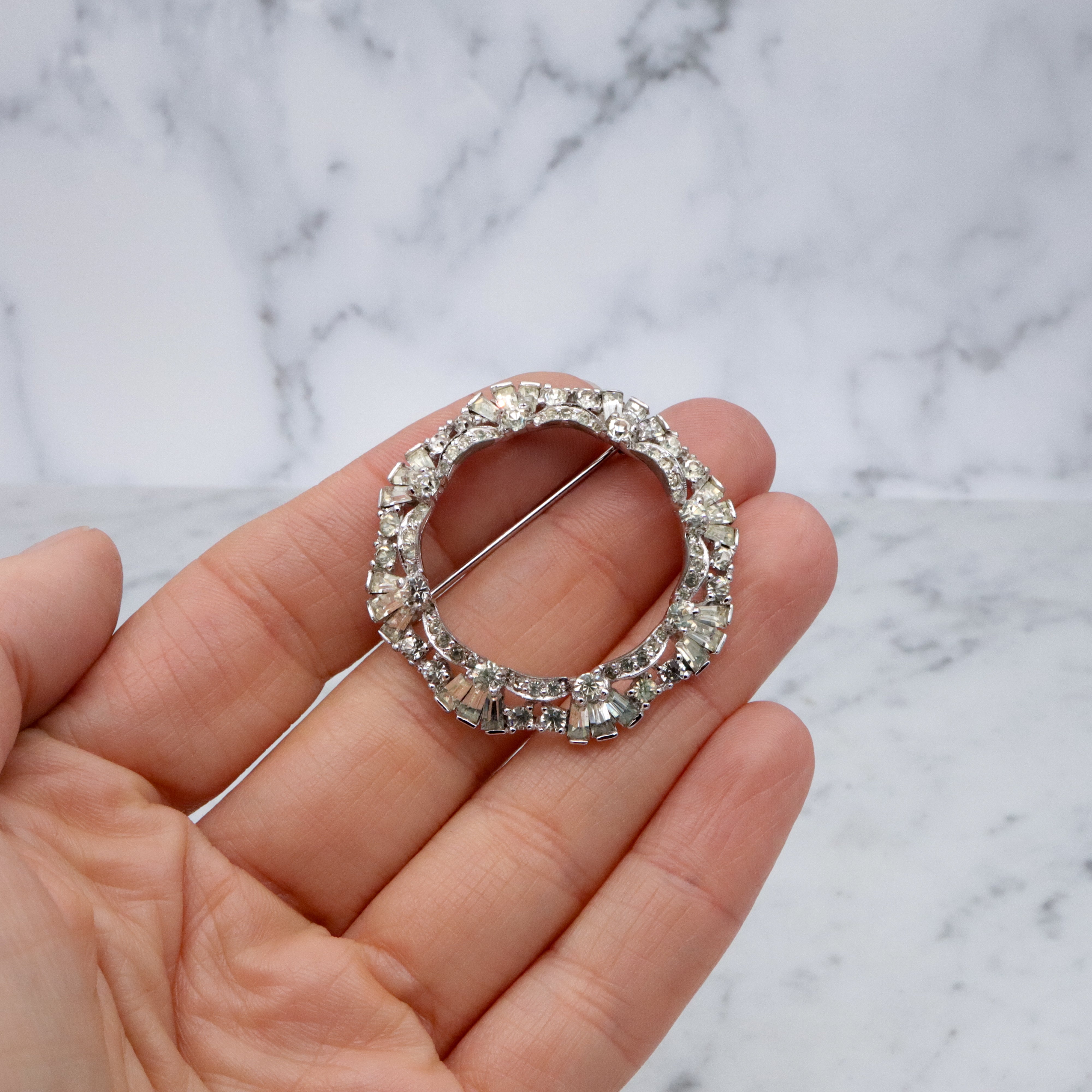 Art Deco Revival Jomaz rhodium plated rhinestone open wreath brooch