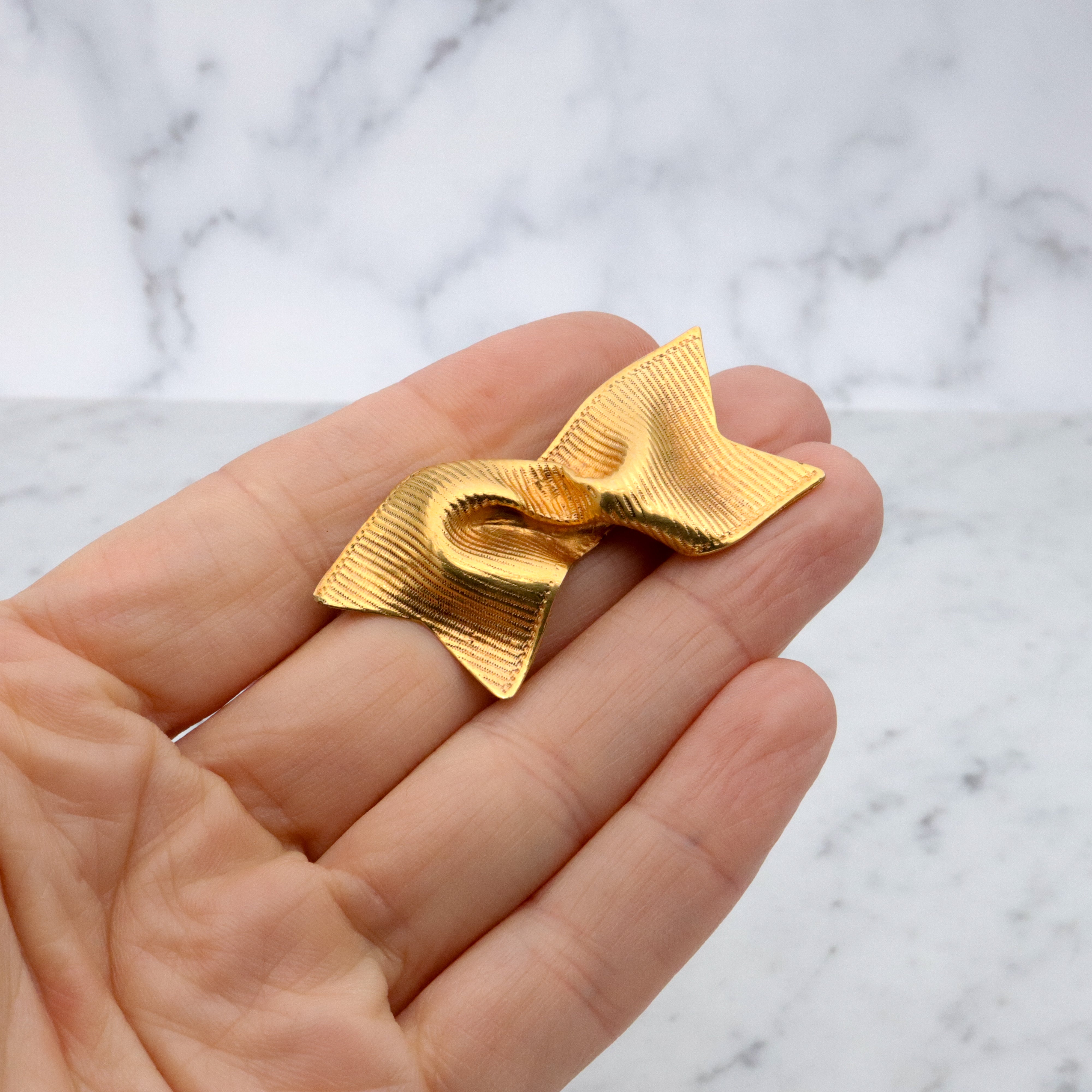 Retro Mignon Faget gold plated twisted ribbon brooch