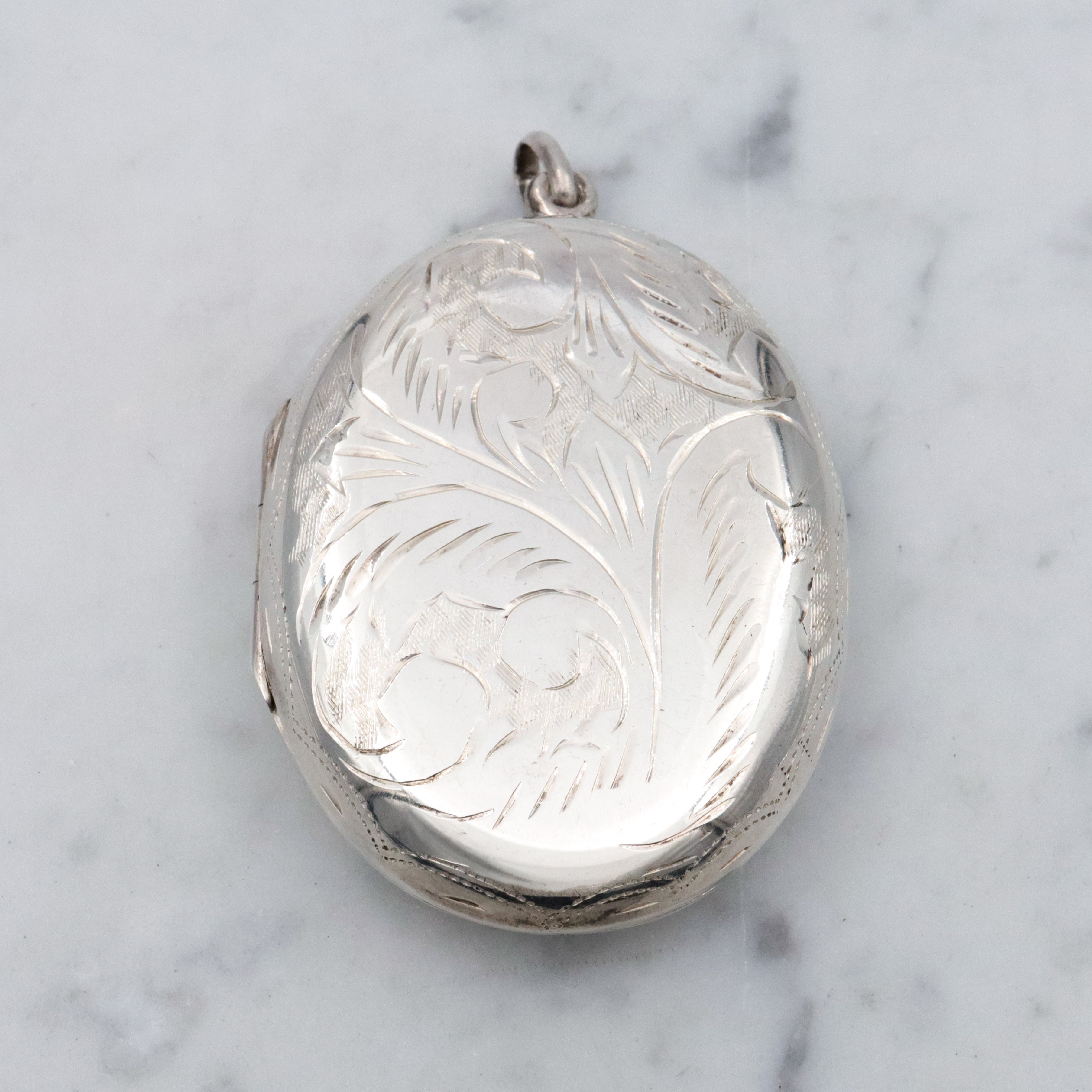 Vintage large floral engraved sterling locket pendant