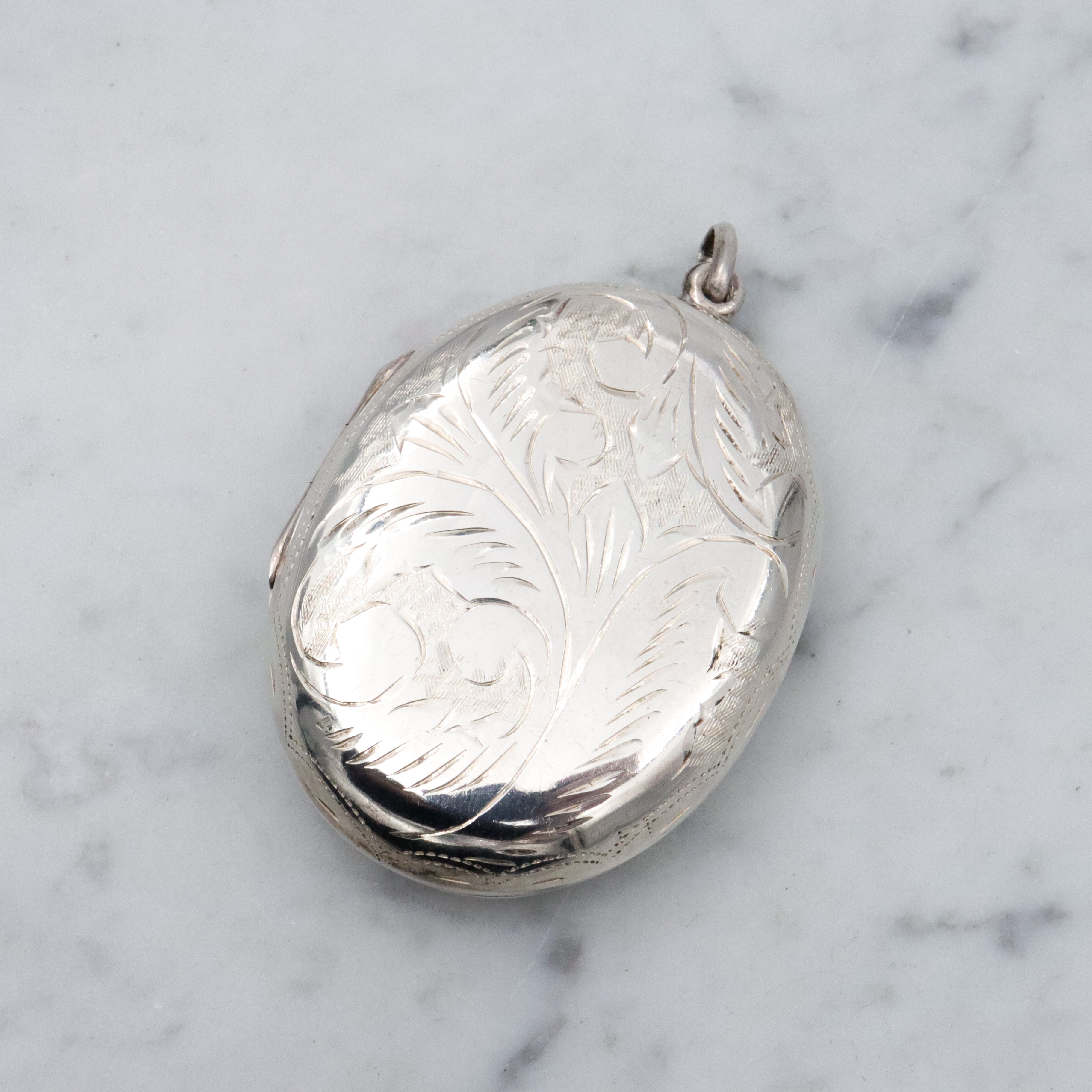 Vintage large floral engraved sterling locket pendant