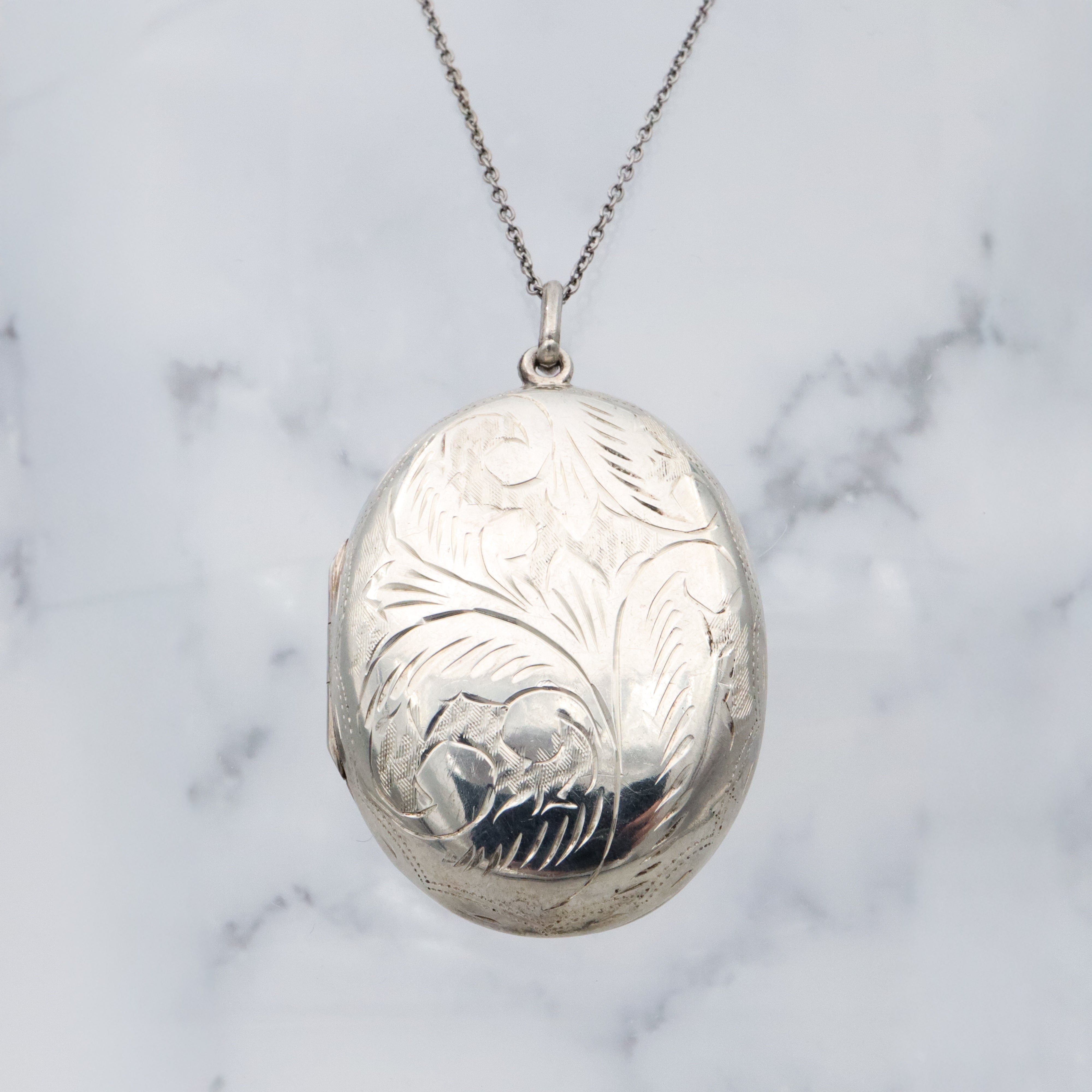 Vintage large floral engraved sterling locket pendant