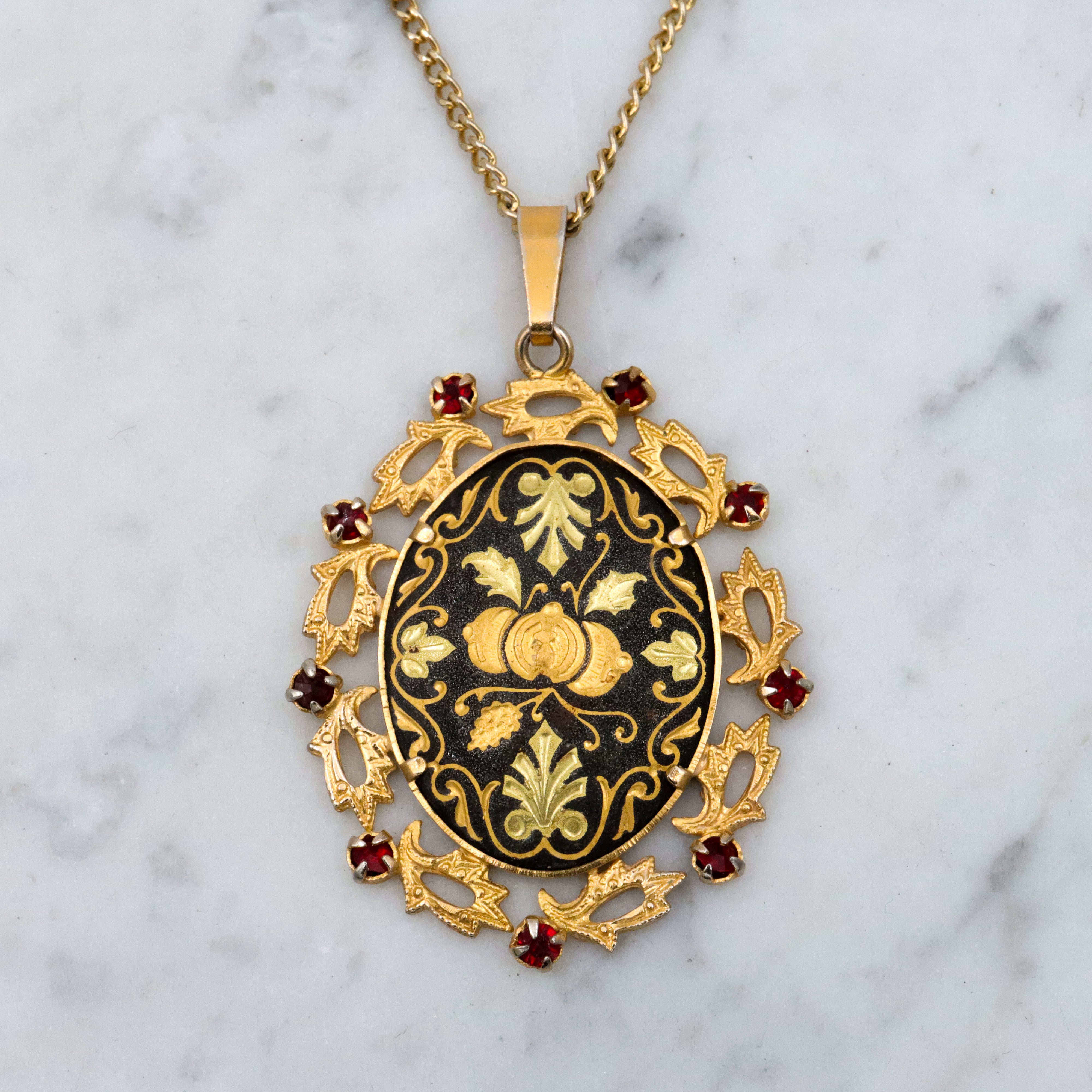 Mid Century Spanish damascene floral pendant with red rhinestone accents