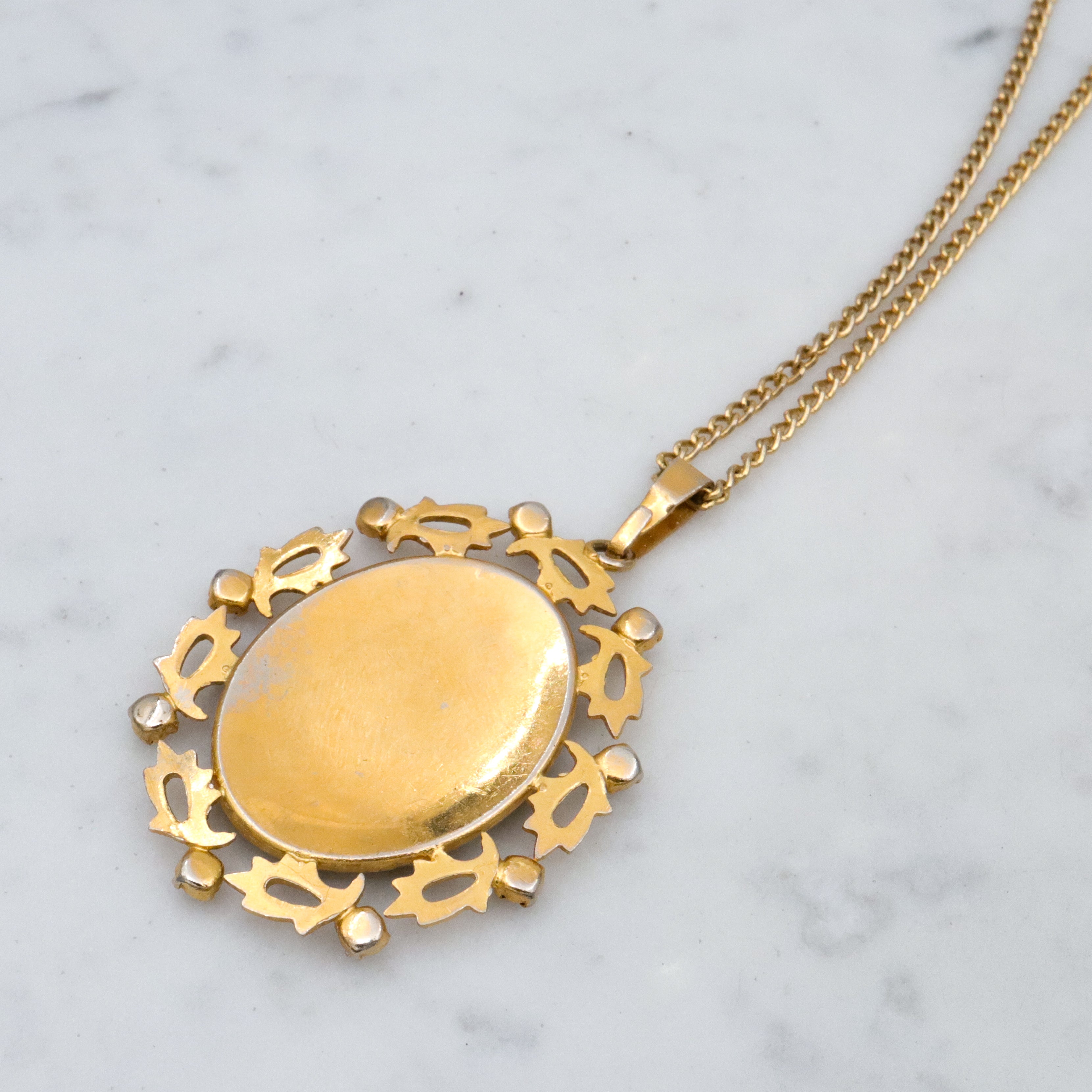 Mid Century Spanish damascene floral pendant with red rhinestone accents