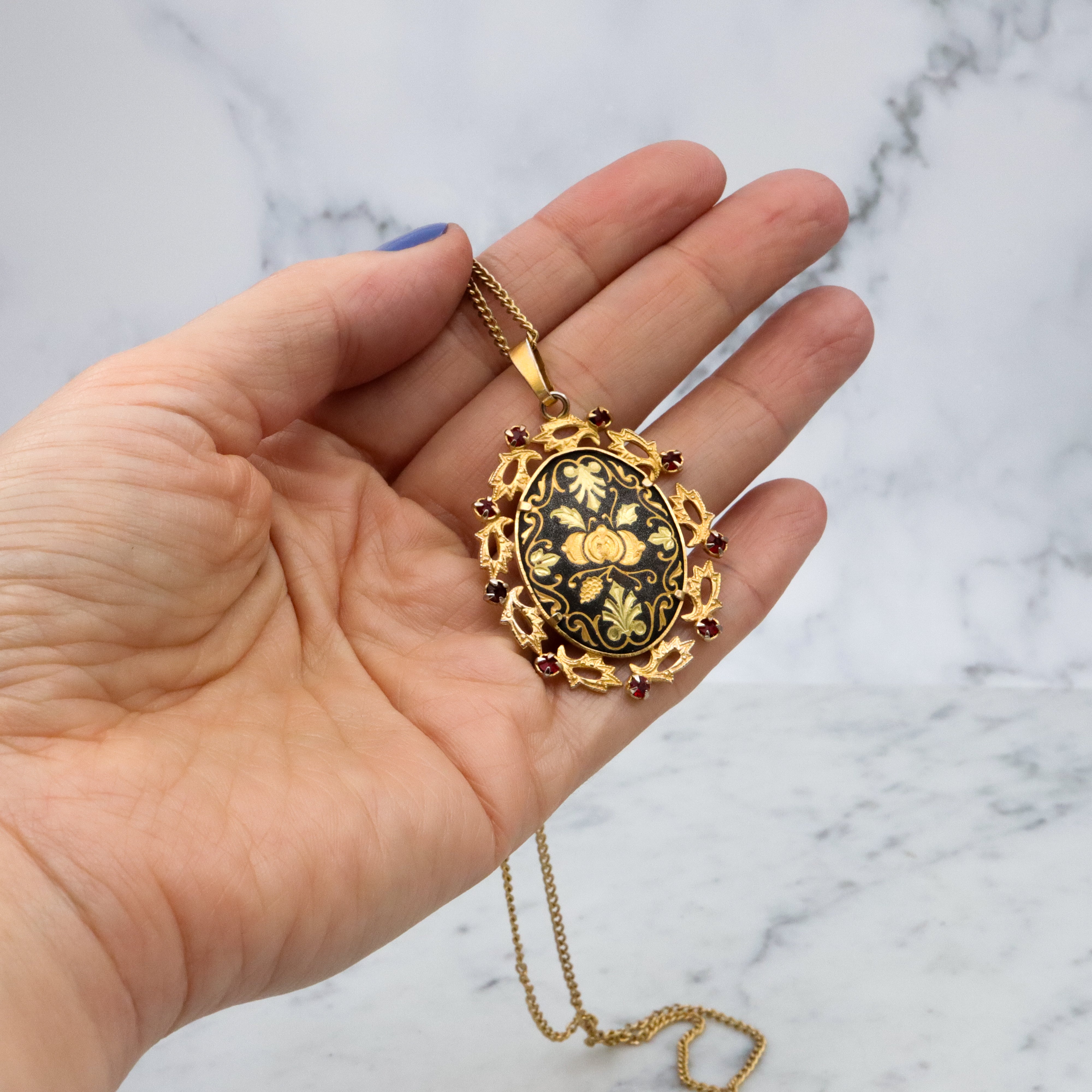 Mid Century Spanish damascene floral pendant with red rhinestone accents