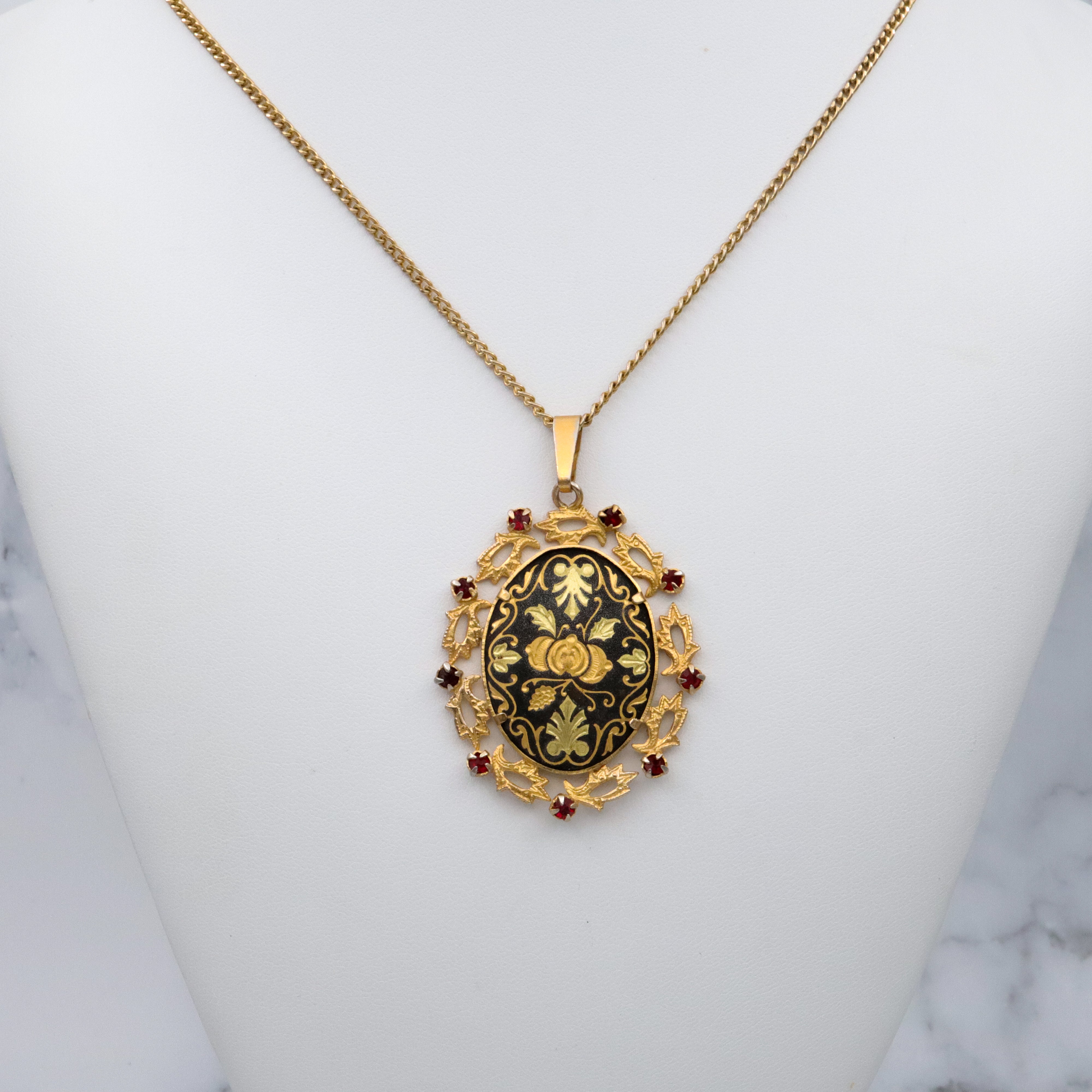 Mid Century Spanish damascene floral pendant with red rhinestone accents