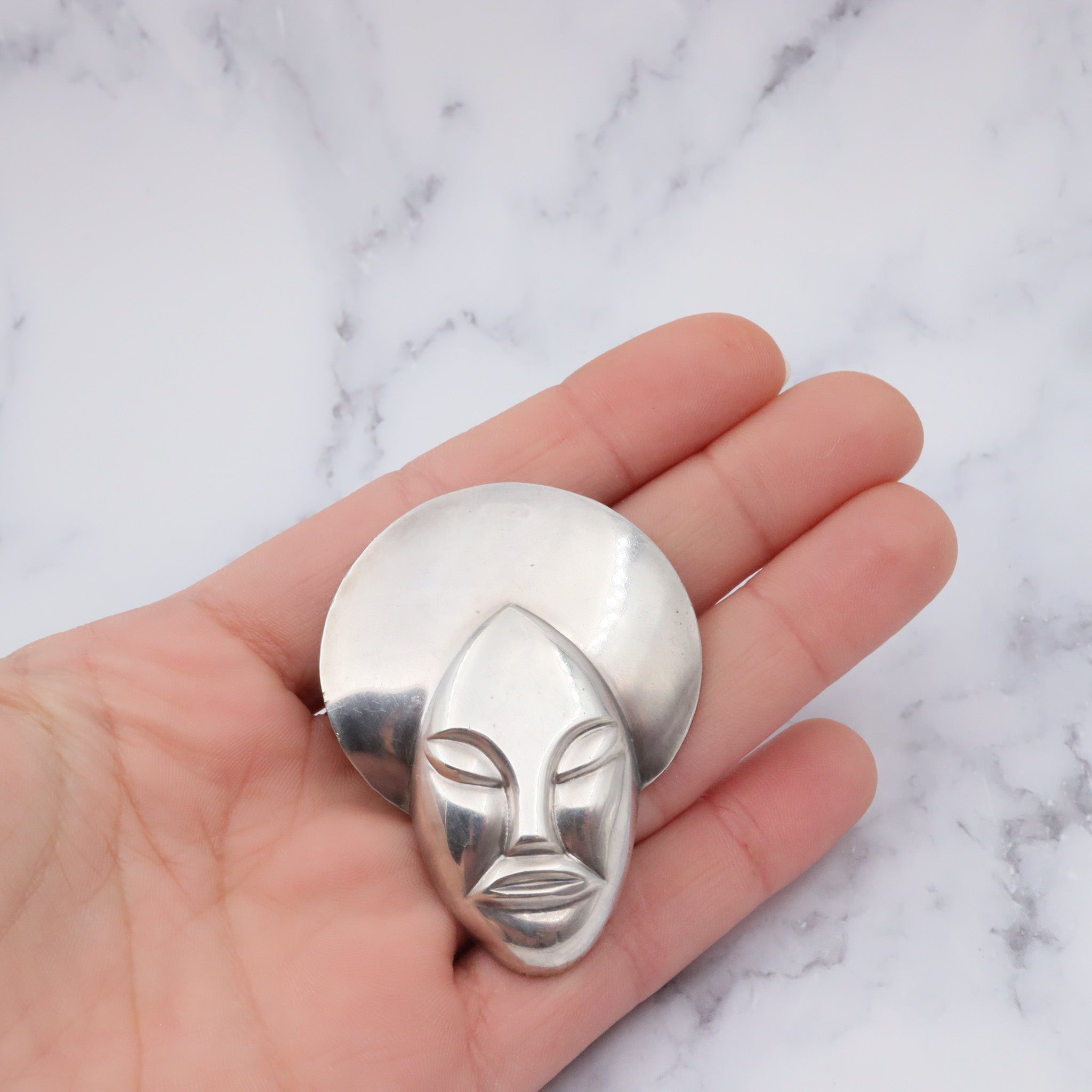 Vintage sterling face brooch