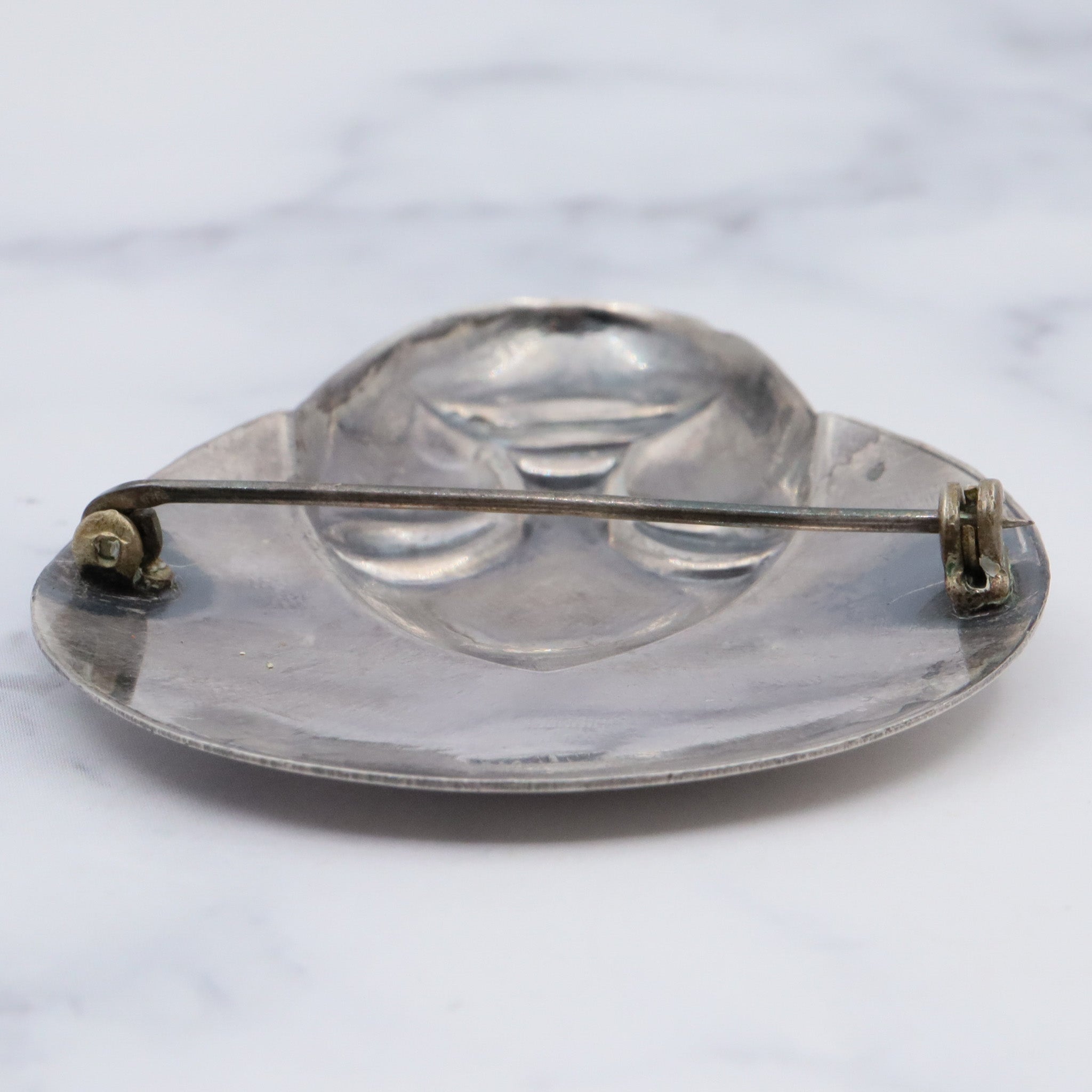 Vintage sterling face brooch