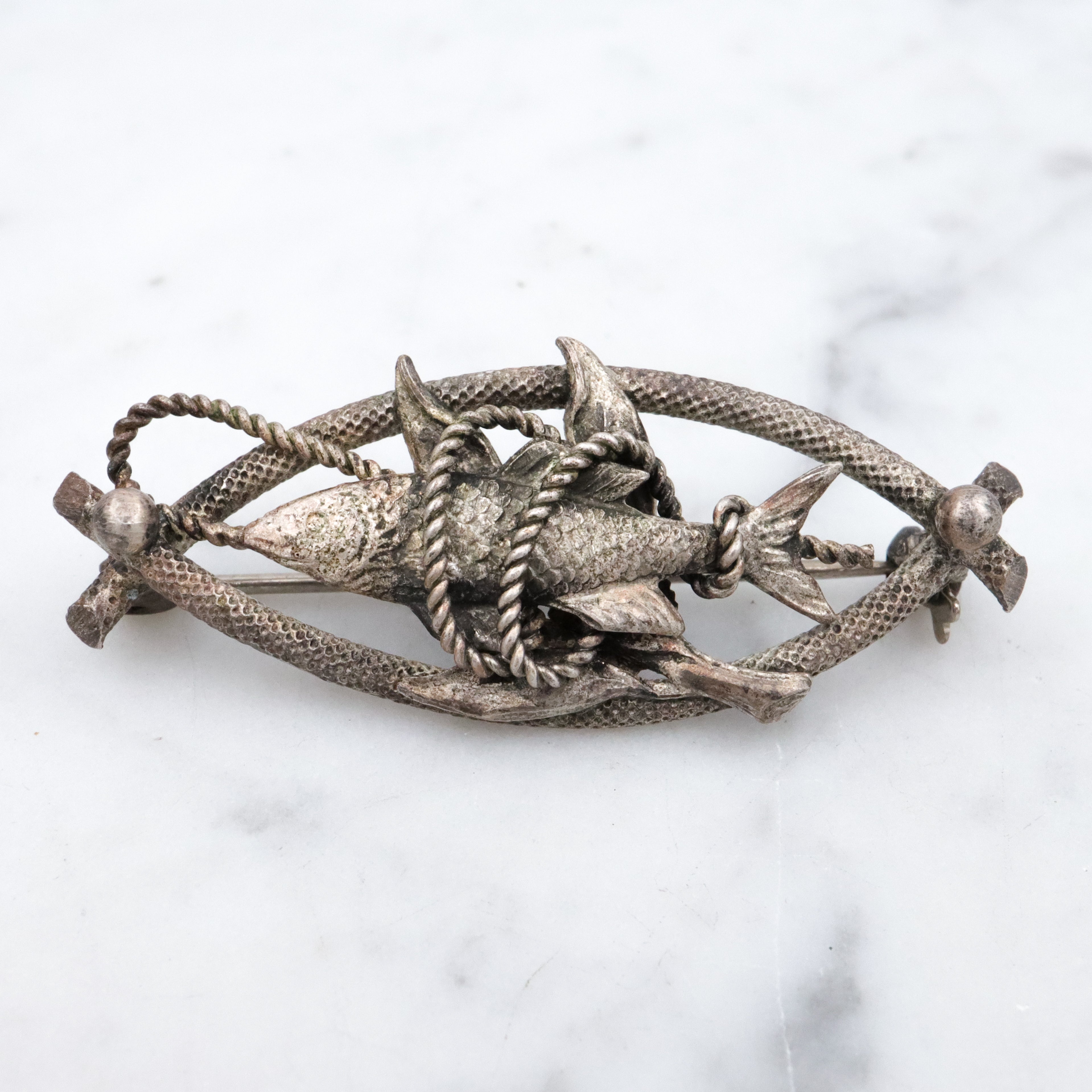 Vintage 1950s Western Germany "fish caught on a rope" silver plated brooch