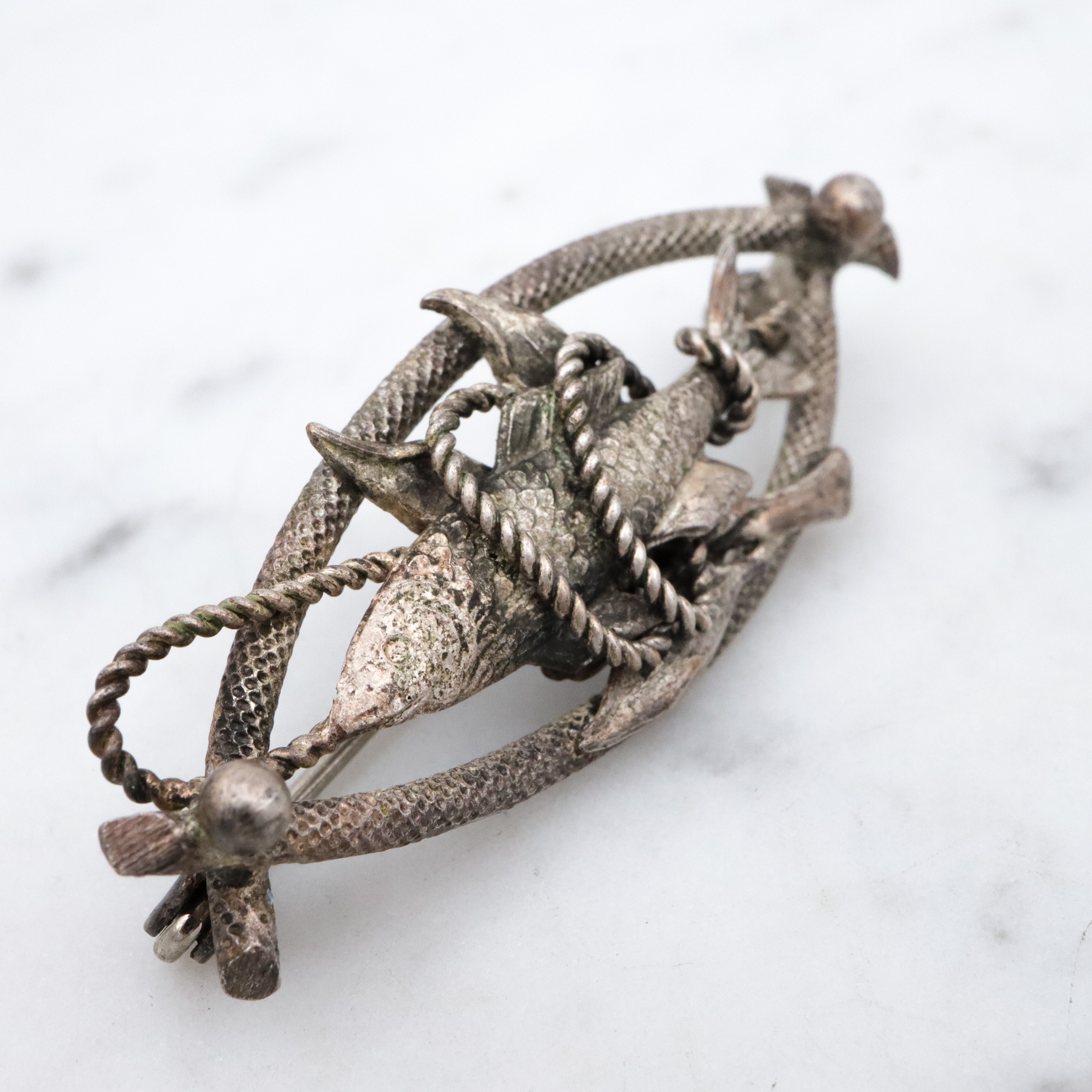 Vintage 1950s Western Germany "fish caught on a rope" silver plated brooch