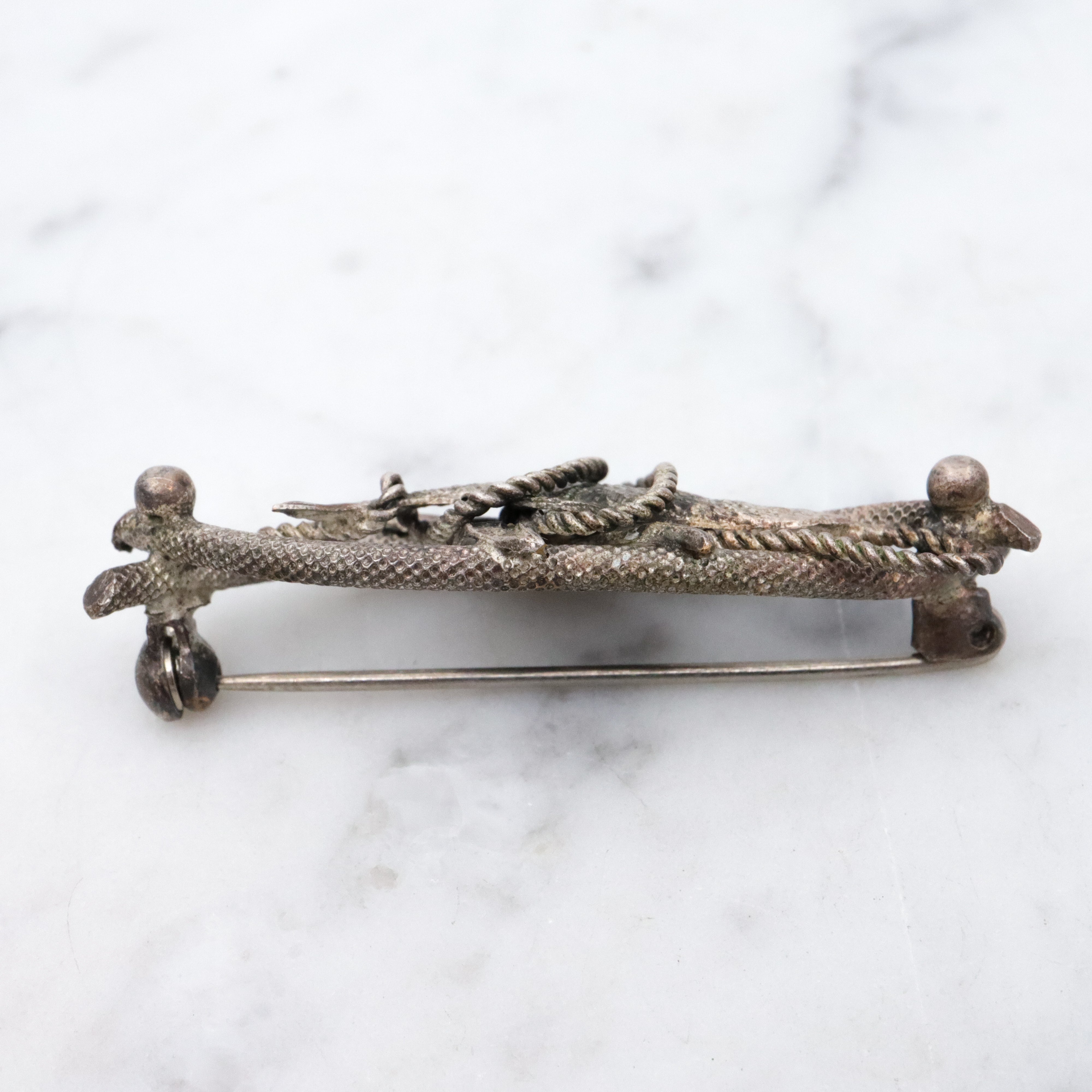 Vintage 1950s Western Germany "fish caught on a rope" silver plated brooch