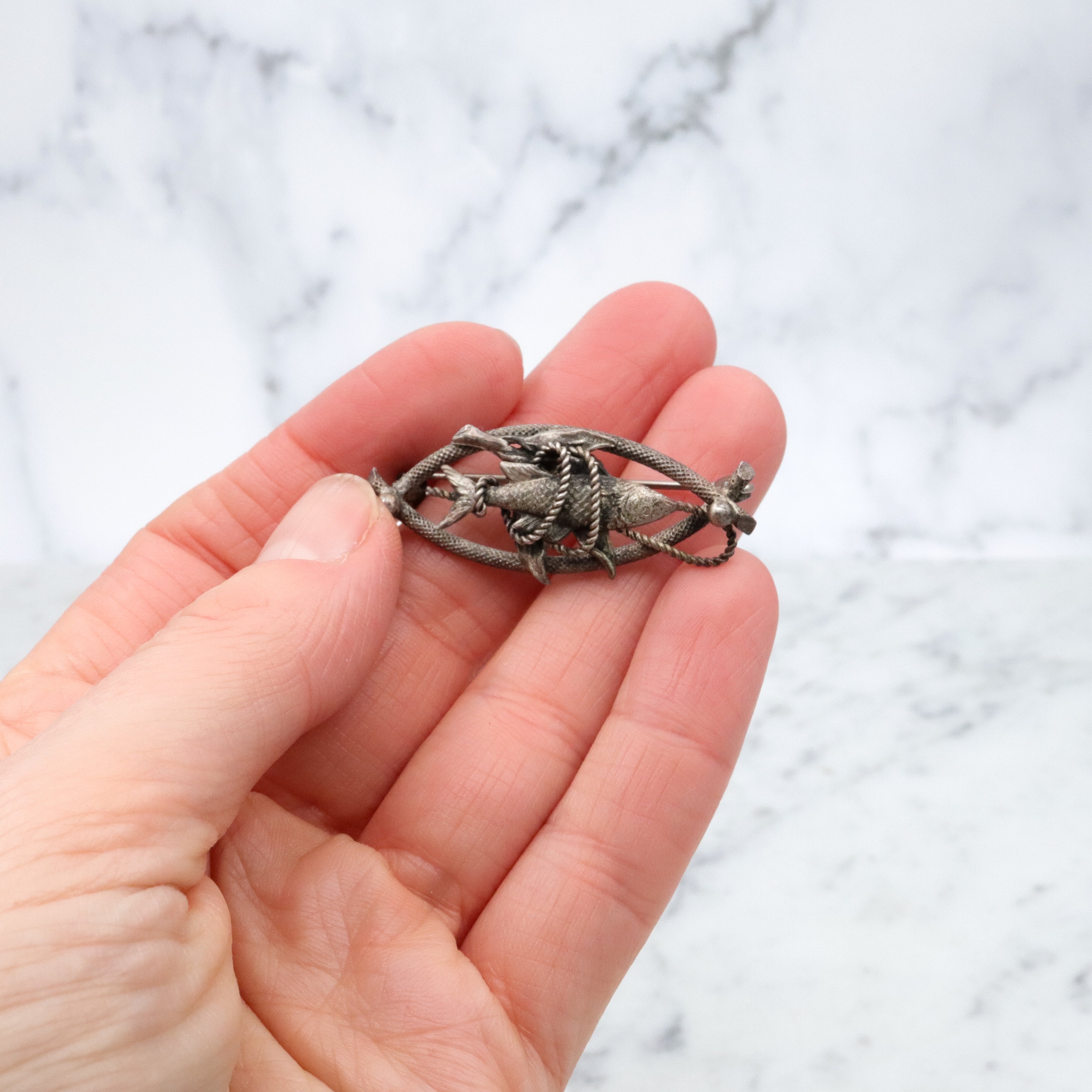 Vintage 1950s Western Germany "fish caught on a rope" silver plated brooch