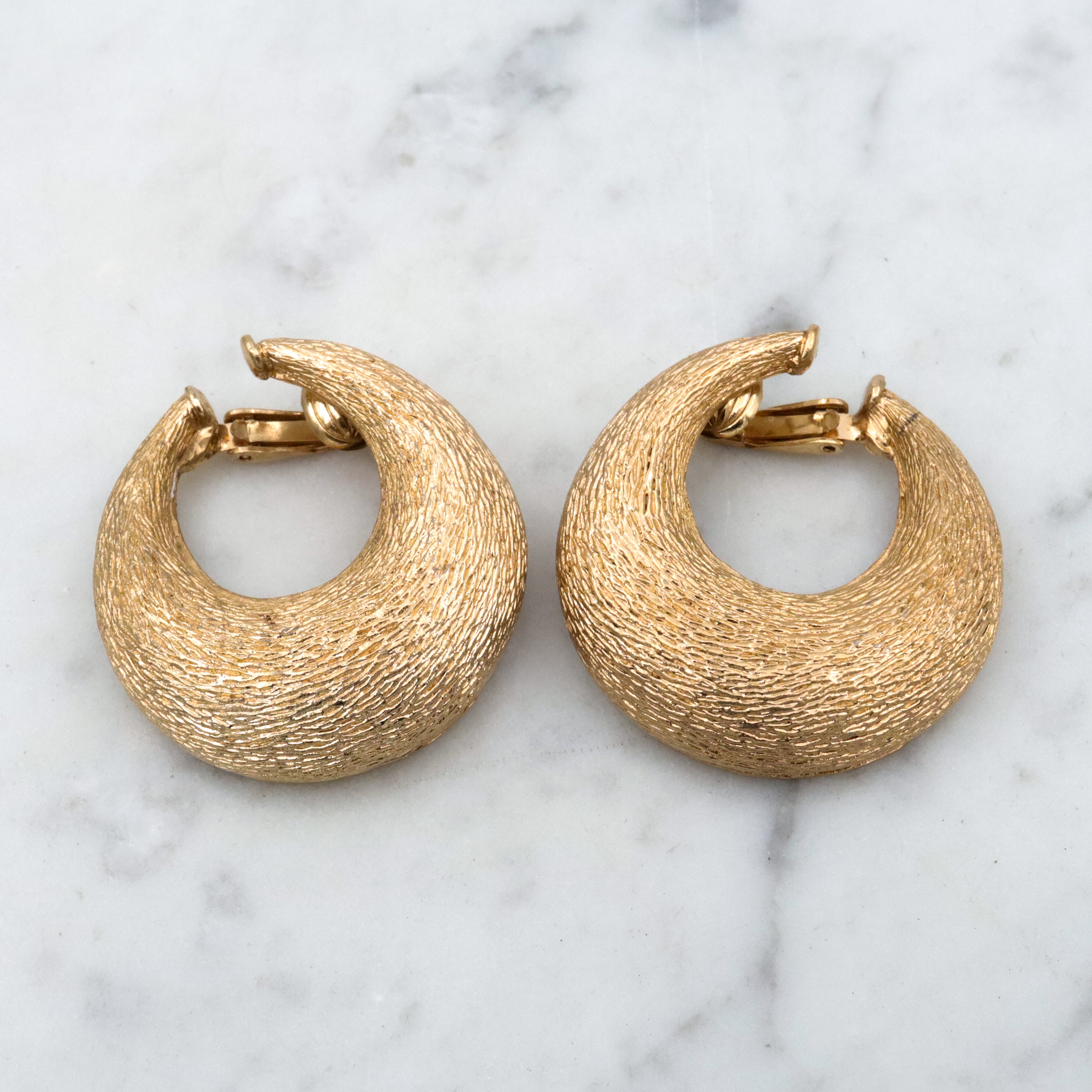 Vintage 70s Ciner textured gold plated flattened hoop huggie clip-on earrings