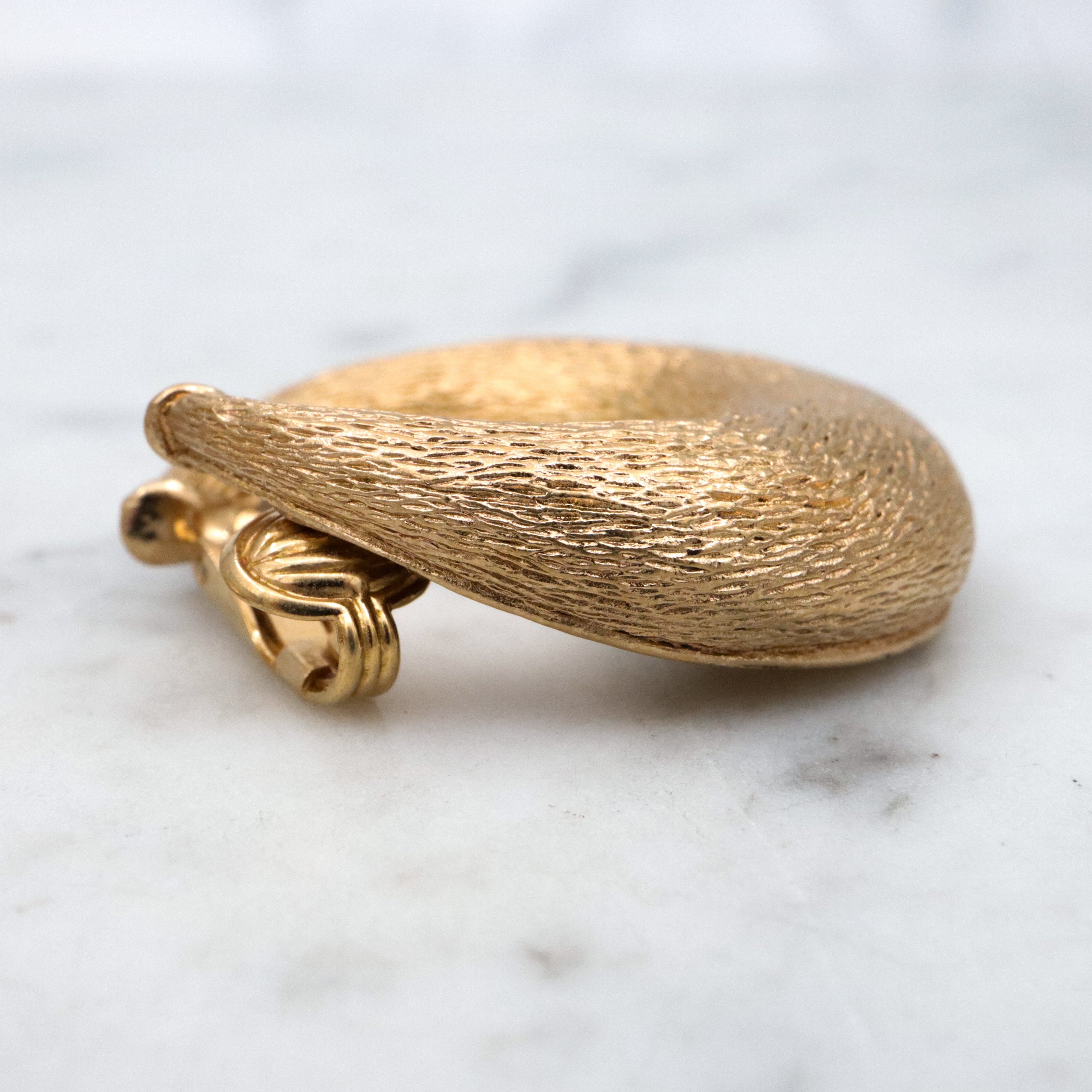 Vintage 70s Ciner textured gold plated flattened hoop huggie clip-on earrings