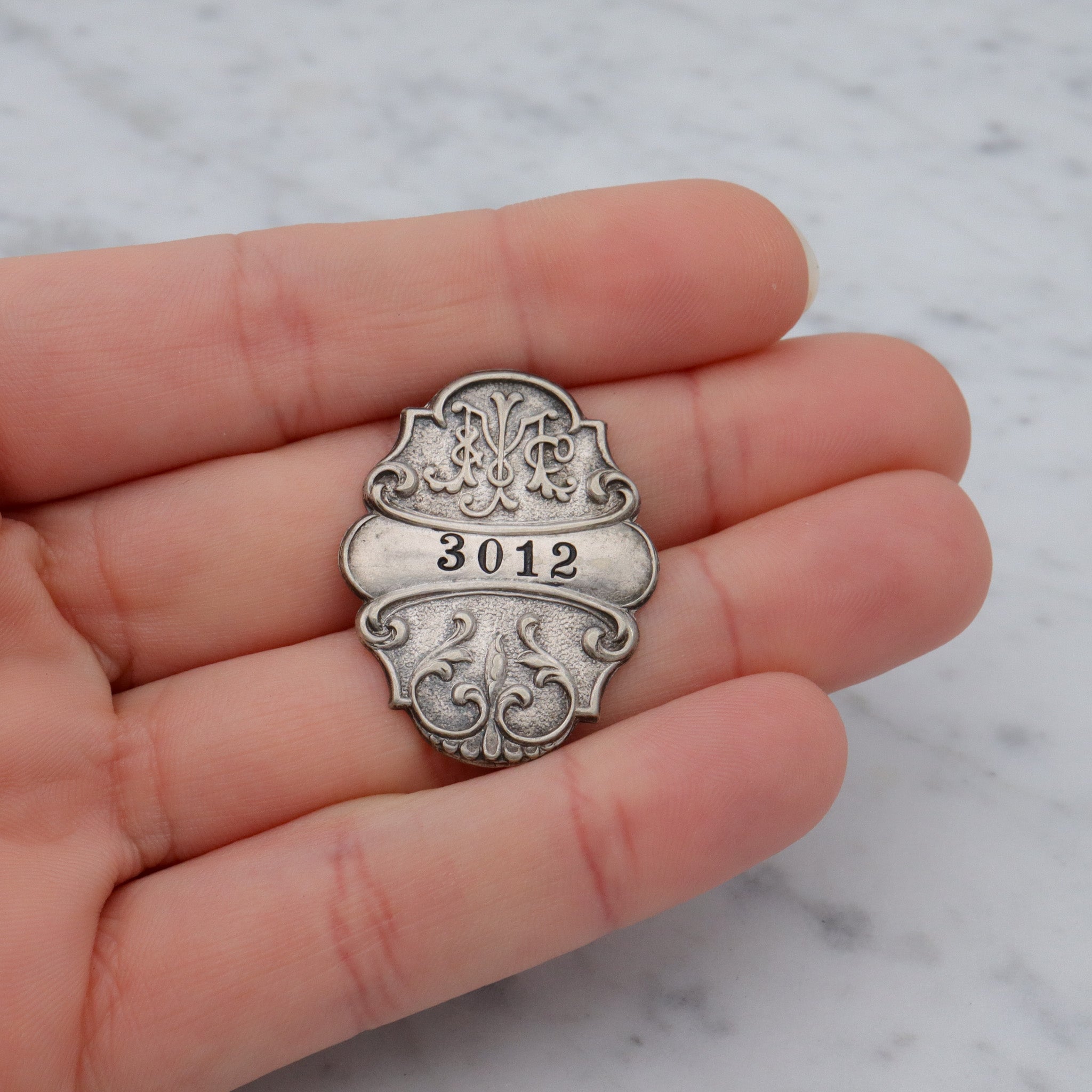 Antique Art Nouveau silver plated department store charge coin