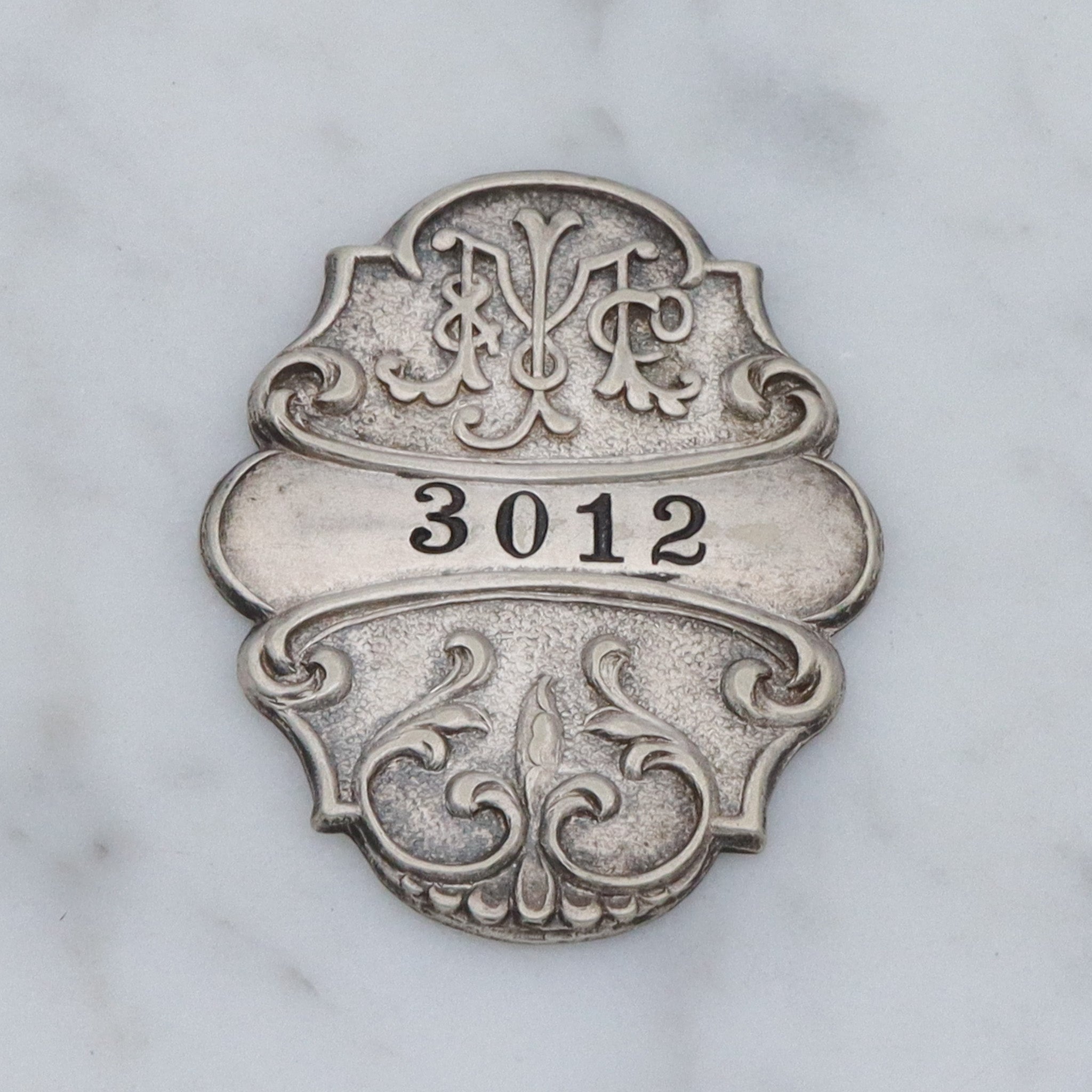 Antique Art Nouveau silver plated department store charge coin