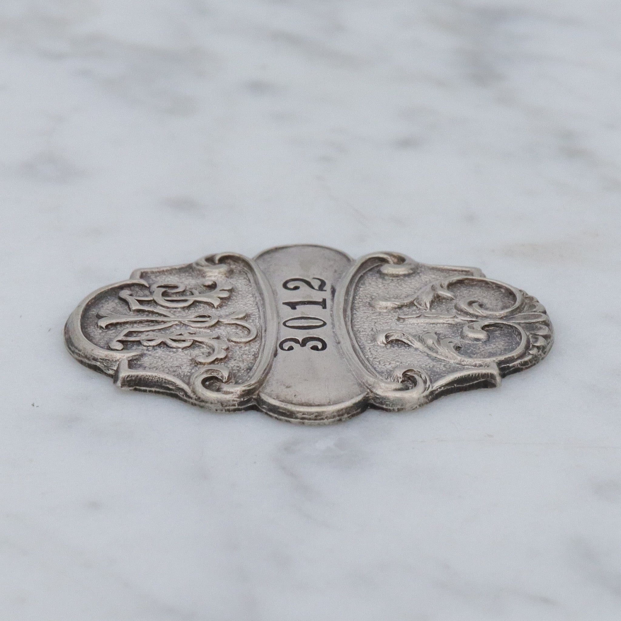 Antique Art Nouveau silver plated department store charge coin