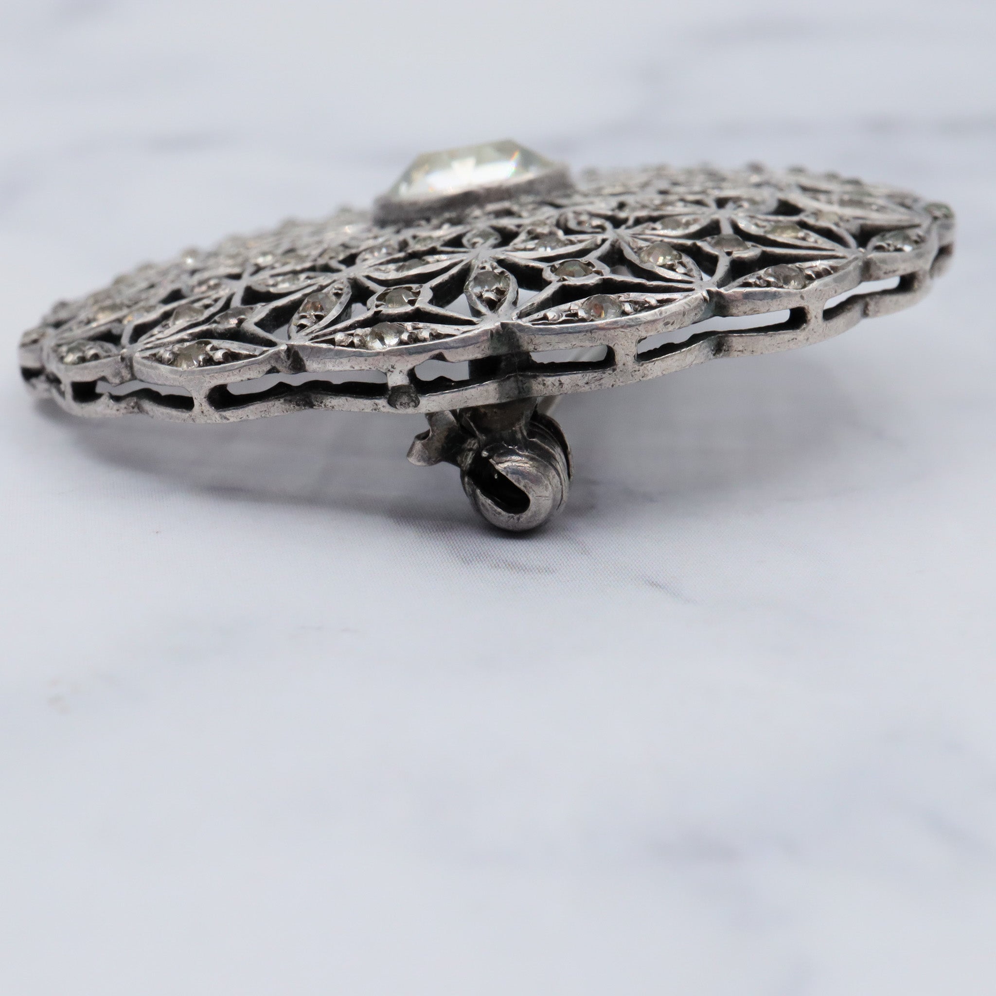 Antique French Art Deco .900 silver & paste filigree circle brooch by Andre Godefroy