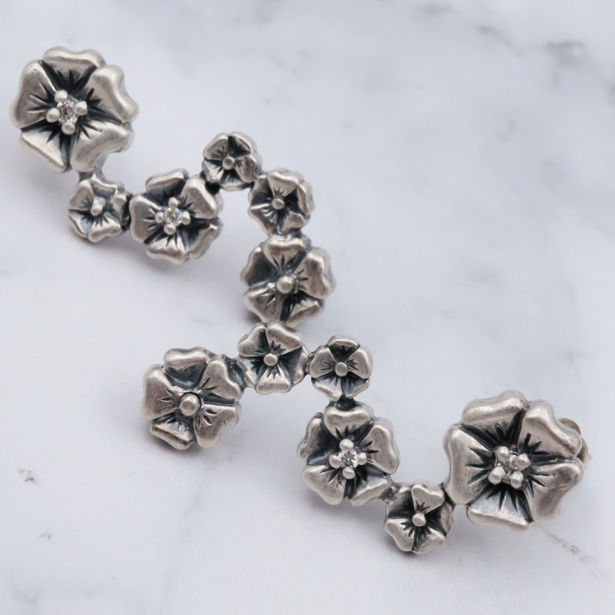 Vintage sterling & diamond flower earrings by “Lyric”