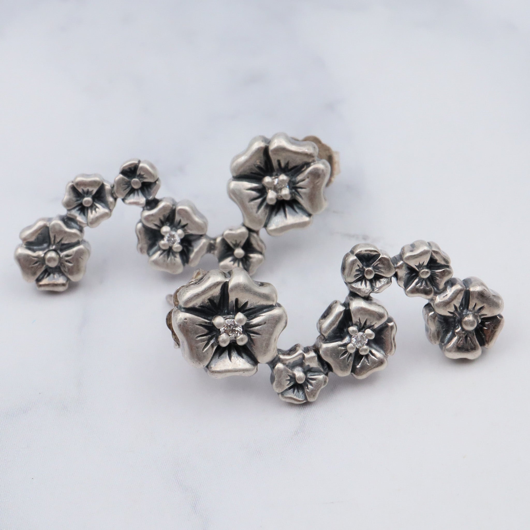 Vintage sterling & diamond flower earrings by “Lyric”