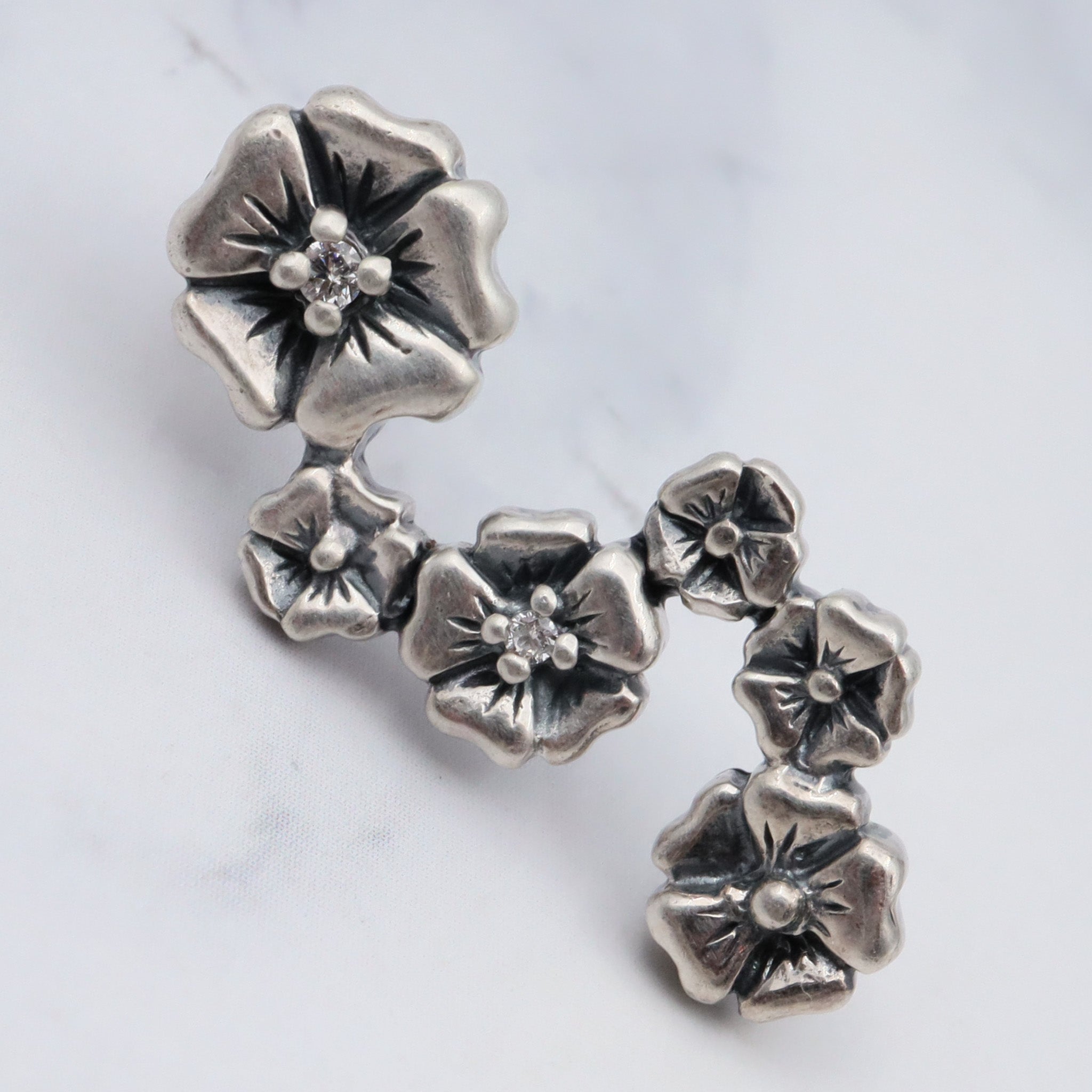 Vintage sterling & diamond flower earrings by “Lyric”