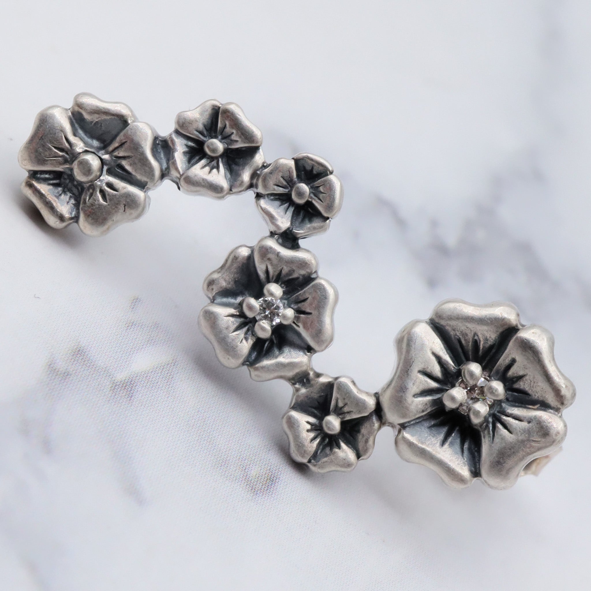 Vintage sterling & diamond flower earrings by “Lyric”
