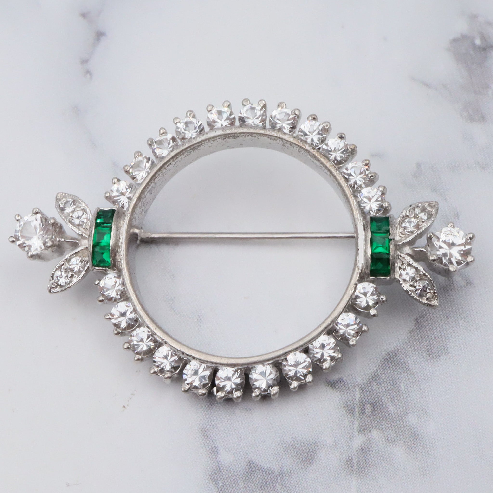 Antique Art Deco rhodium plated sterling, quartz & synthetic emerald circle frame brooch