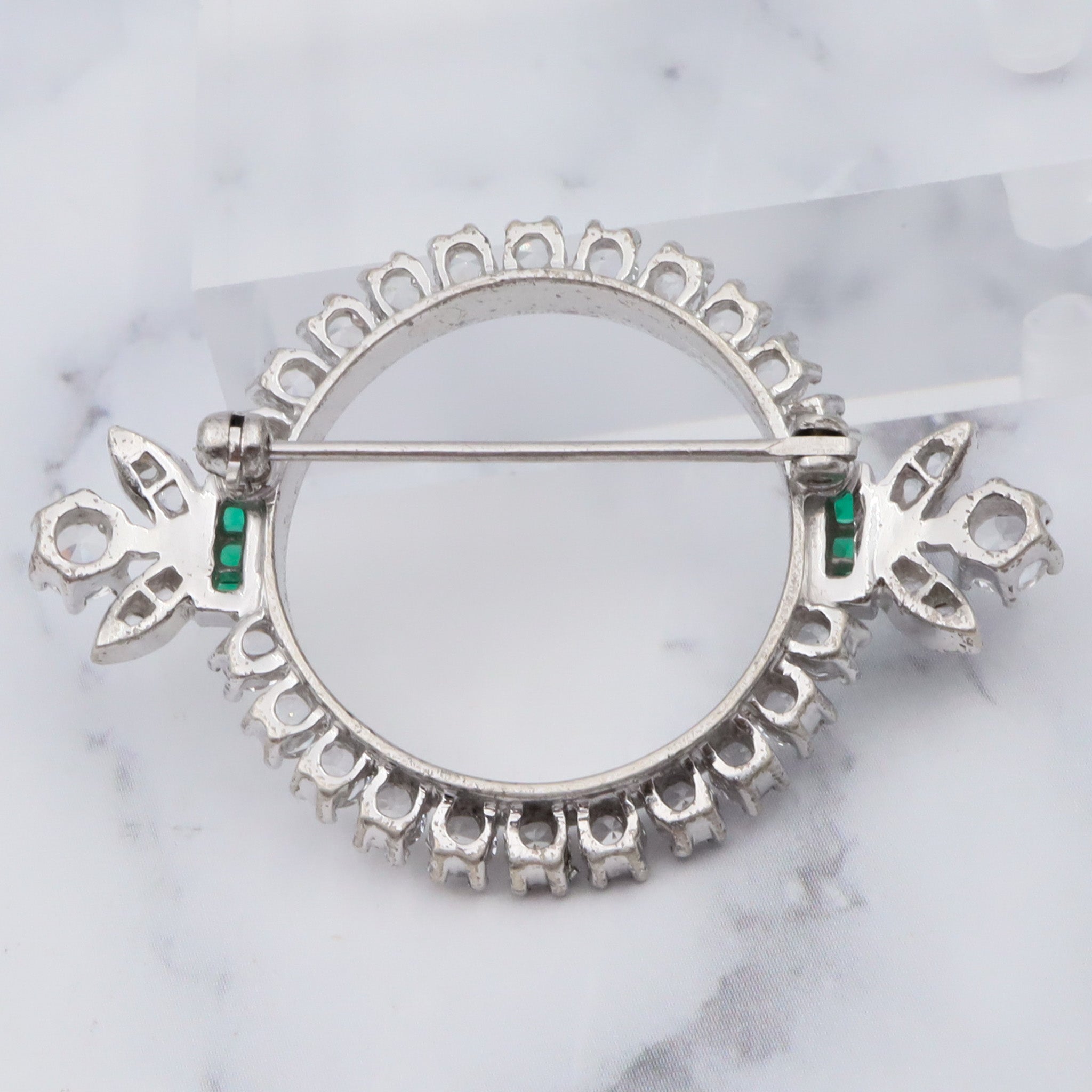 Antique Art Deco rhodium plated sterling, quartz & synthetic emerald circle frame brooch