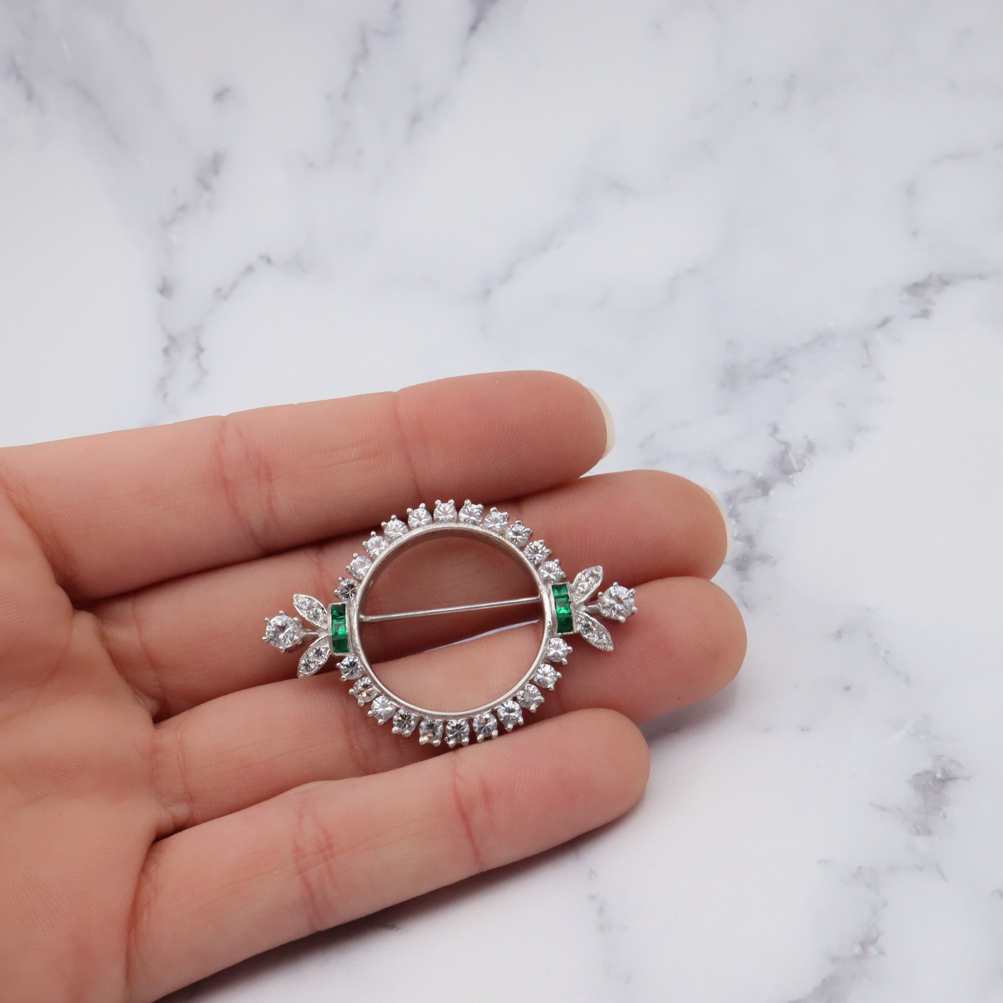 Antique Art Deco rhodium plated sterling, quartz & synthetic emerald circle frame brooch