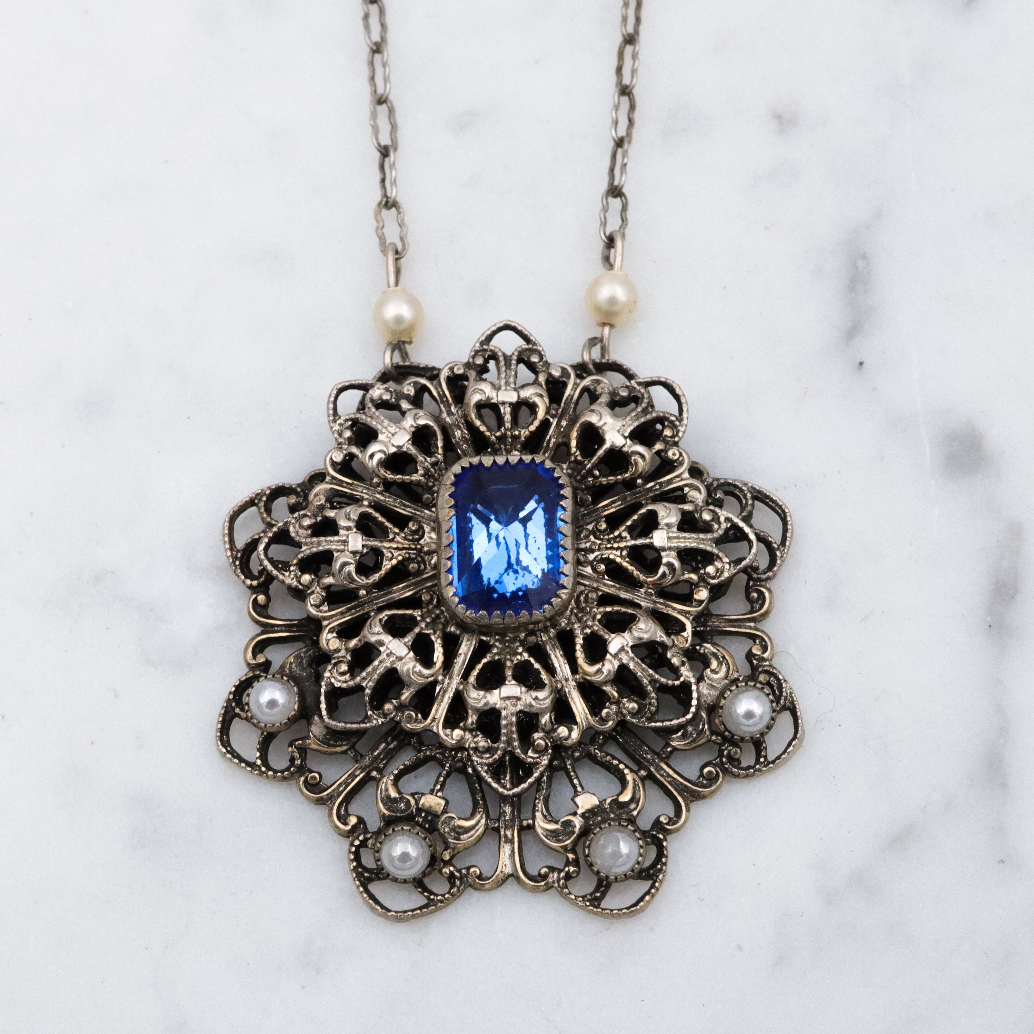 1950s silver tone filigree sapphire crystal & faux pearl flower pendant necklace