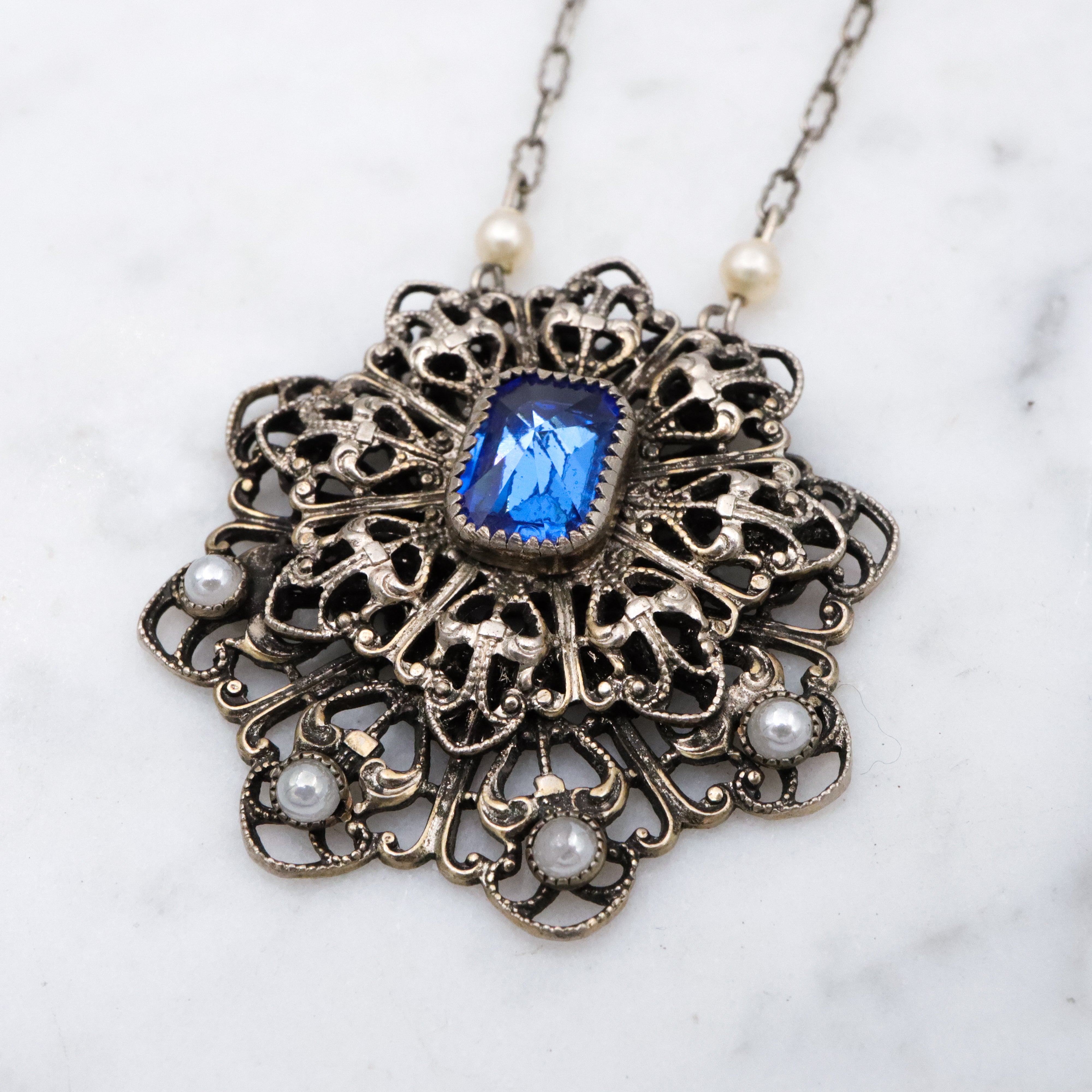1950s silver tone filigree sapphire crystal & faux pearl flower pendant necklace