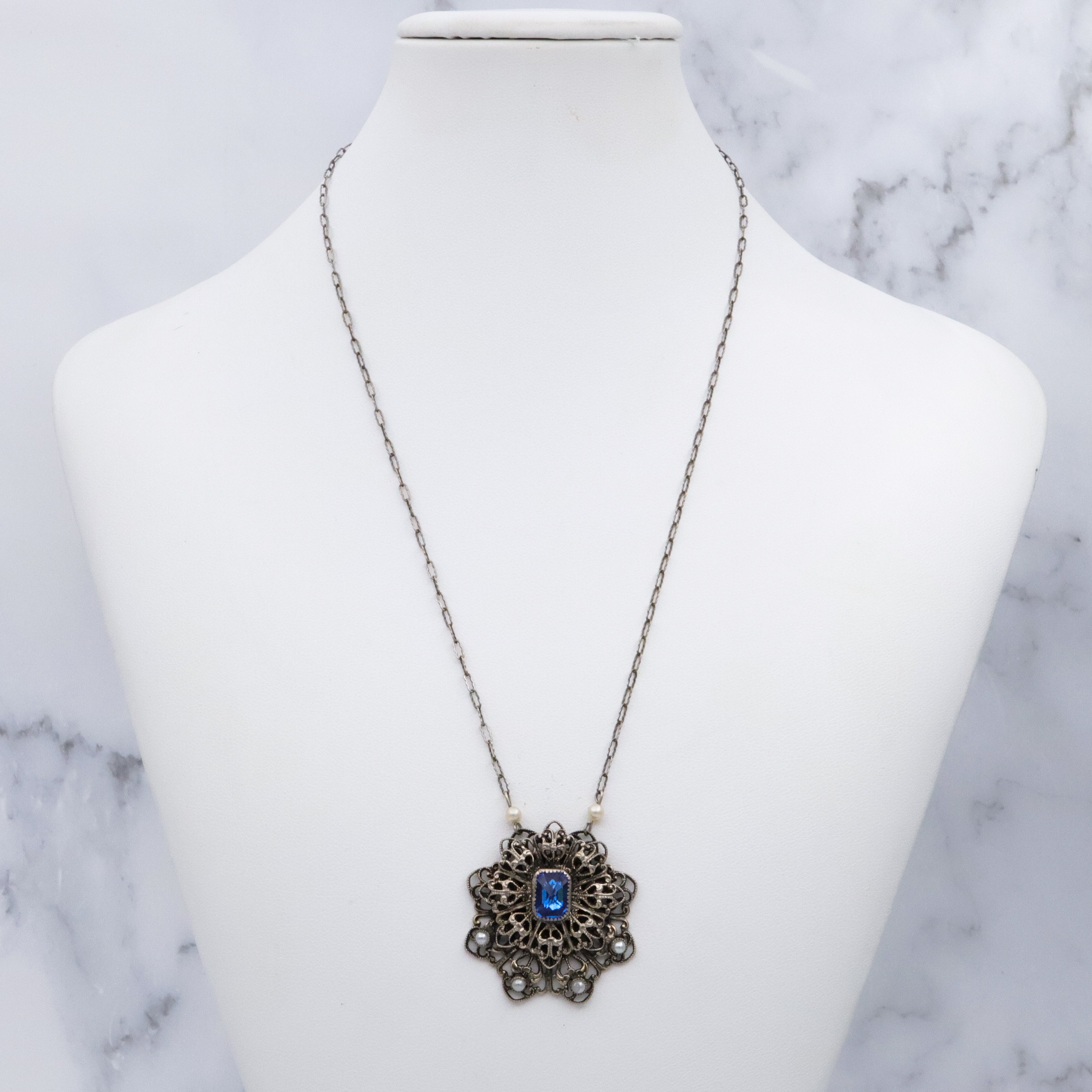1950s silver tone filigree sapphire crystal & faux pearl flower pendant necklace